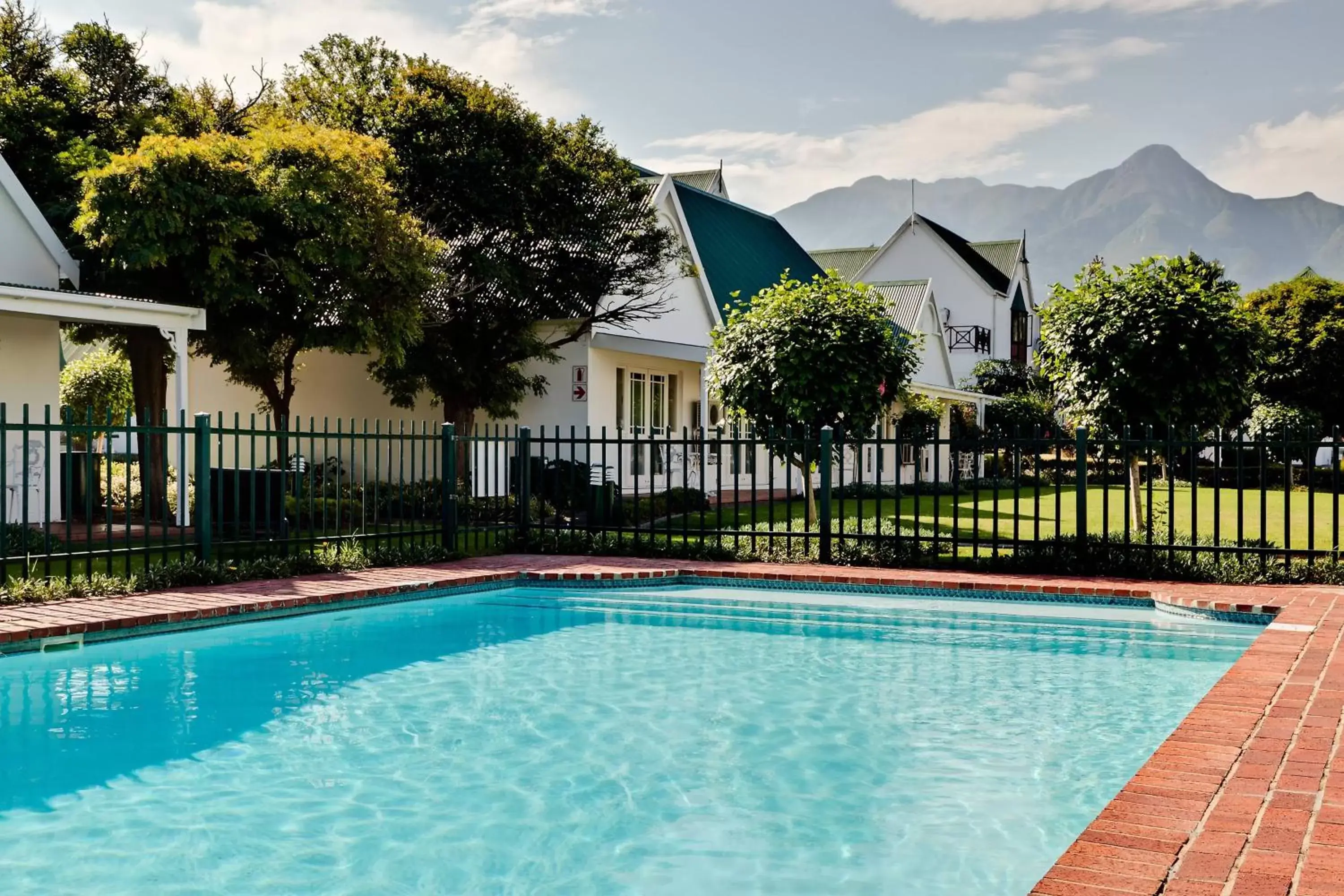 Swimming pool, Property Building in Protea Hotel by Marriott George King George