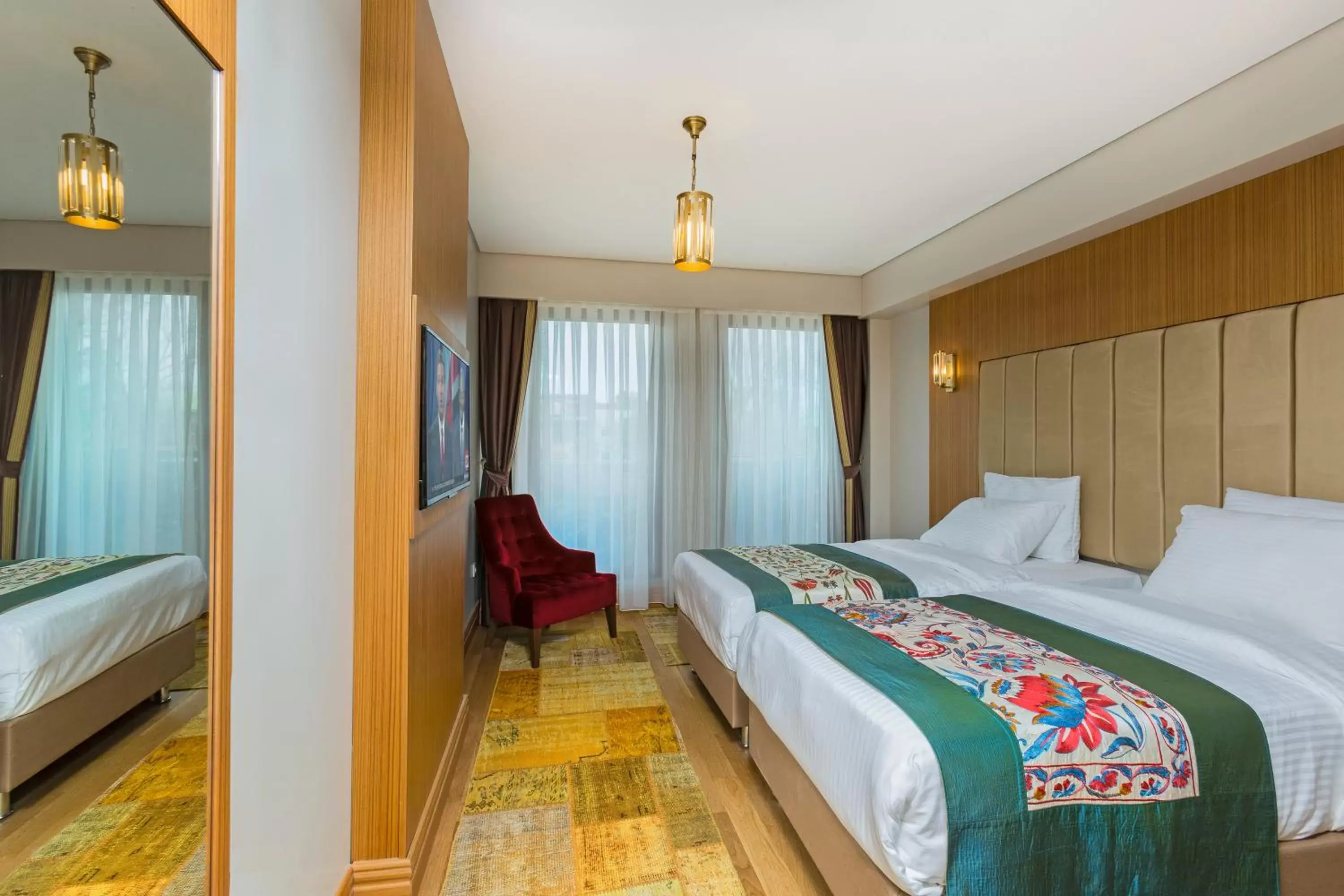 Bed in Obelisk Hotel & Suites