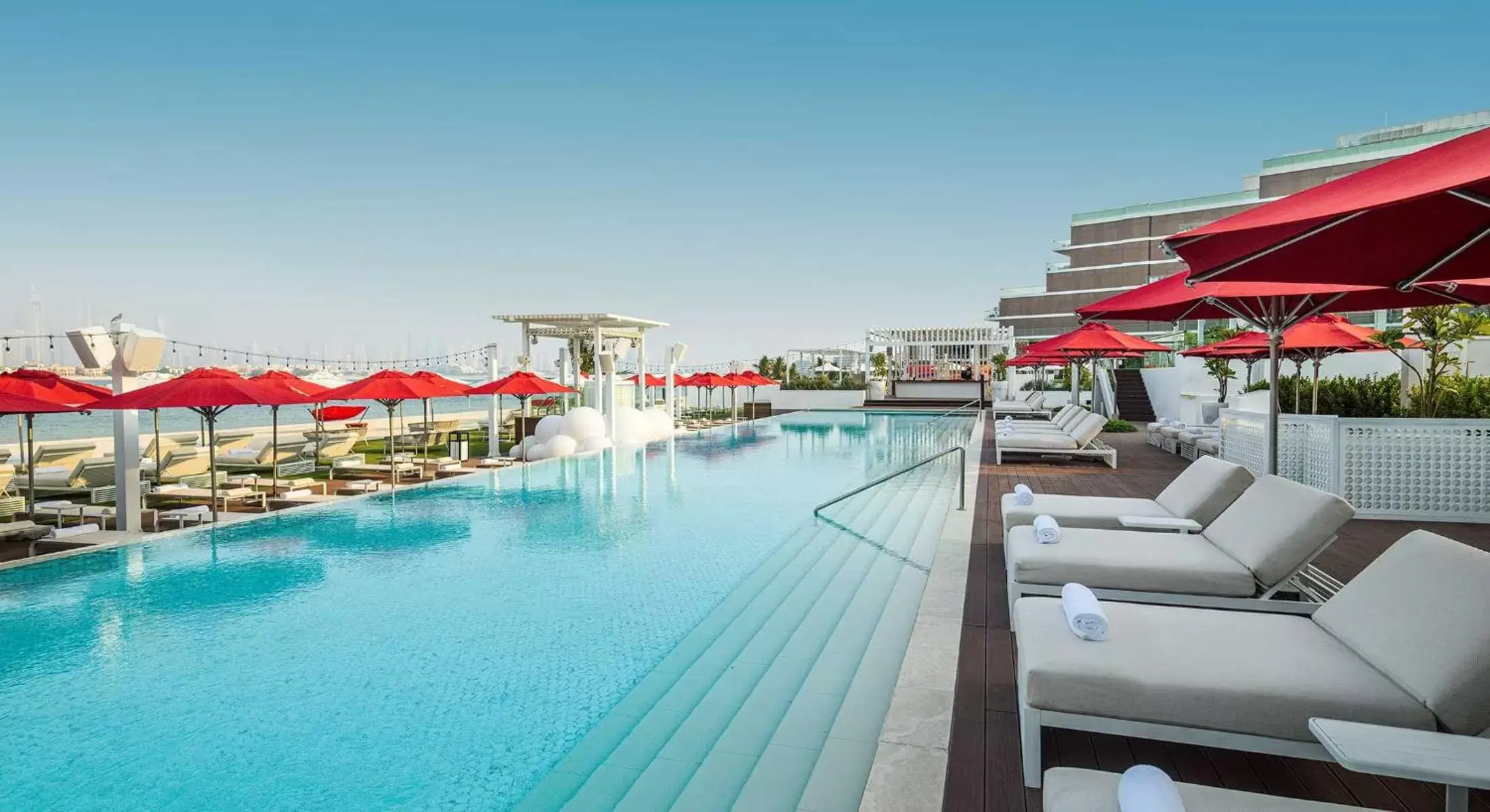 Swimming Pool in Th8 Palm Dubai Beach Resort Vignette Collection, an IHG hotel