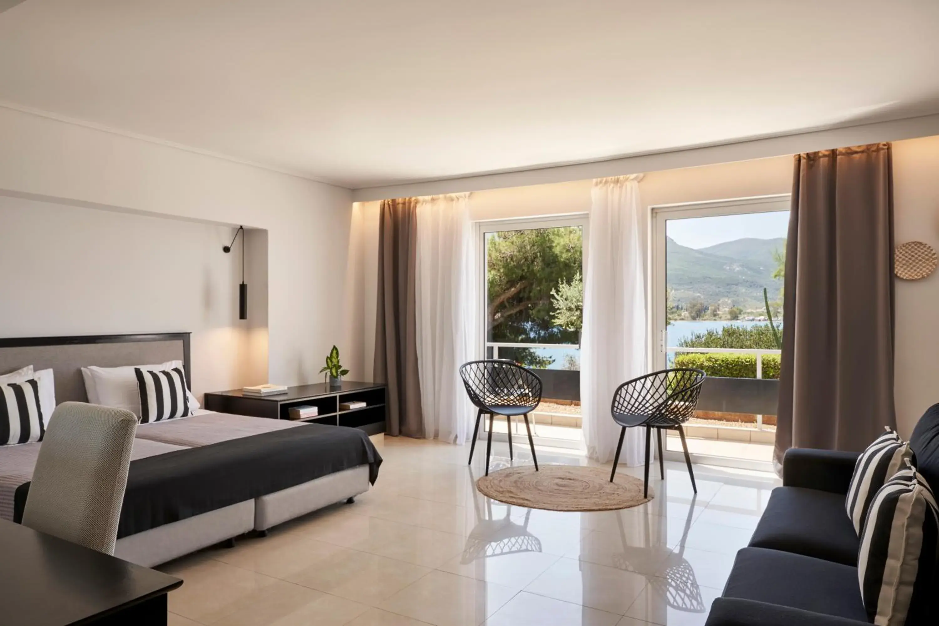 Bedroom, Seating Area in Xenia Poros Image Hotel