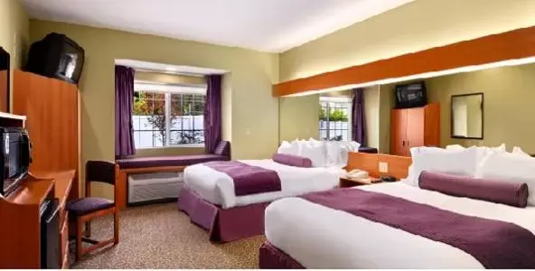Deluxe Queen Room with Two Queen Beds - single occupancy in Stay Beyond Inn & Suites