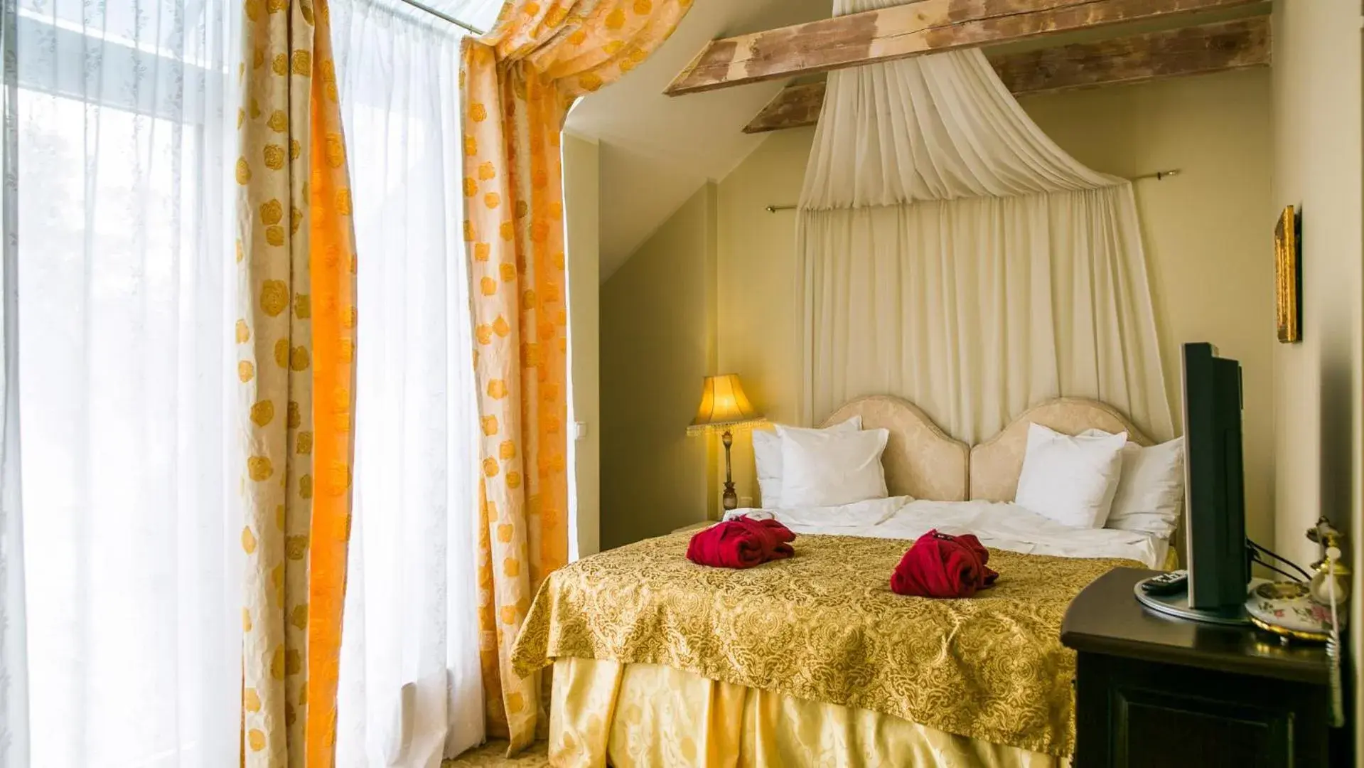 Bed in Grand Rose SPA Hotel