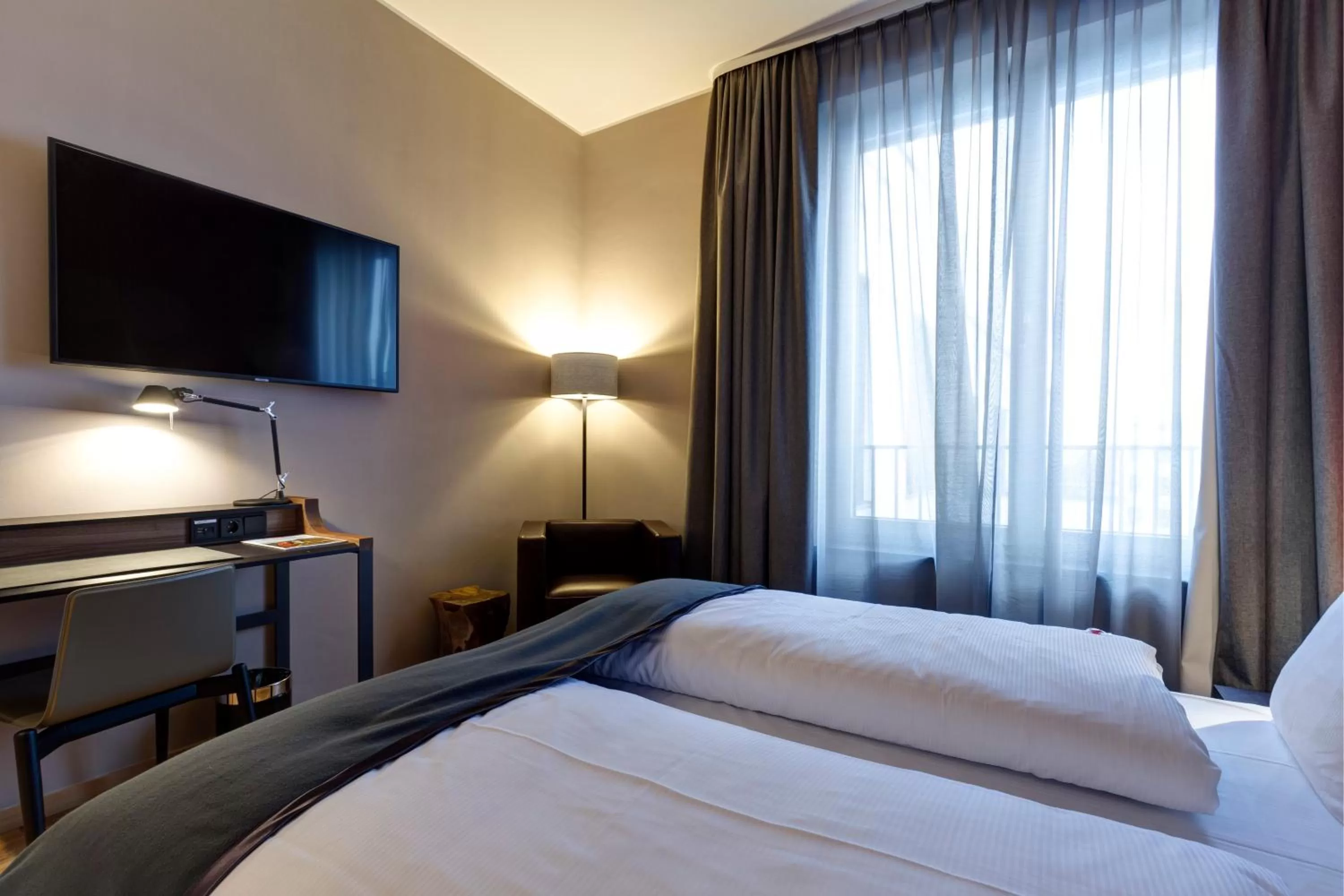 Living room, Bed in Qube Hotel Bahnstadt
