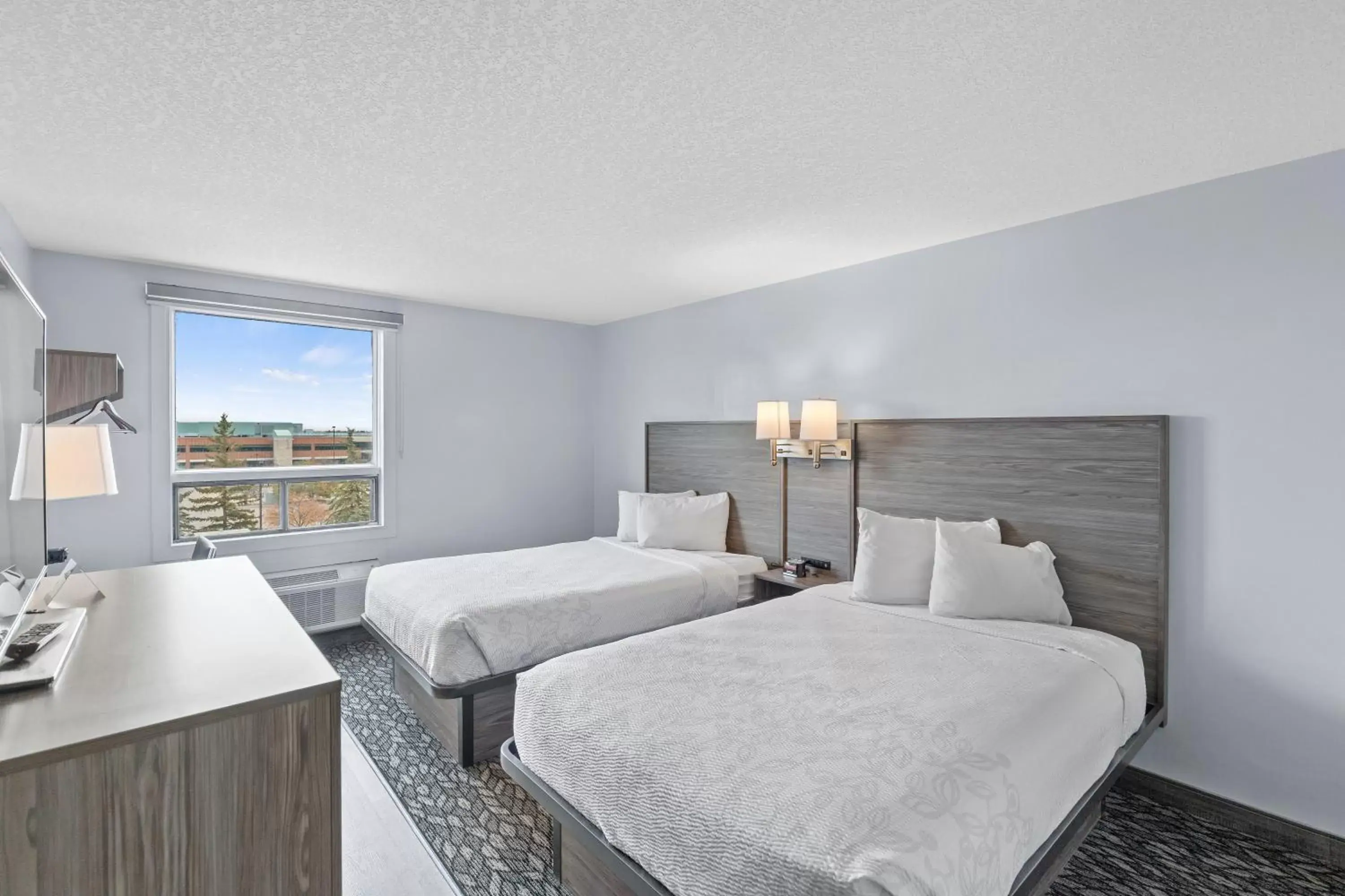 Bed in Emerald Hotel & Suites Calgary Airport