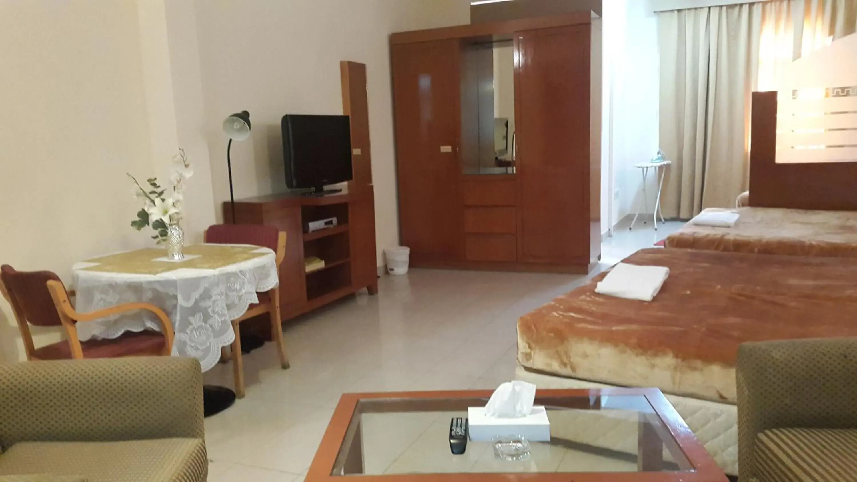Photo of the whole room, TV/Entertainment Center in AL Raien Hotel Apartment