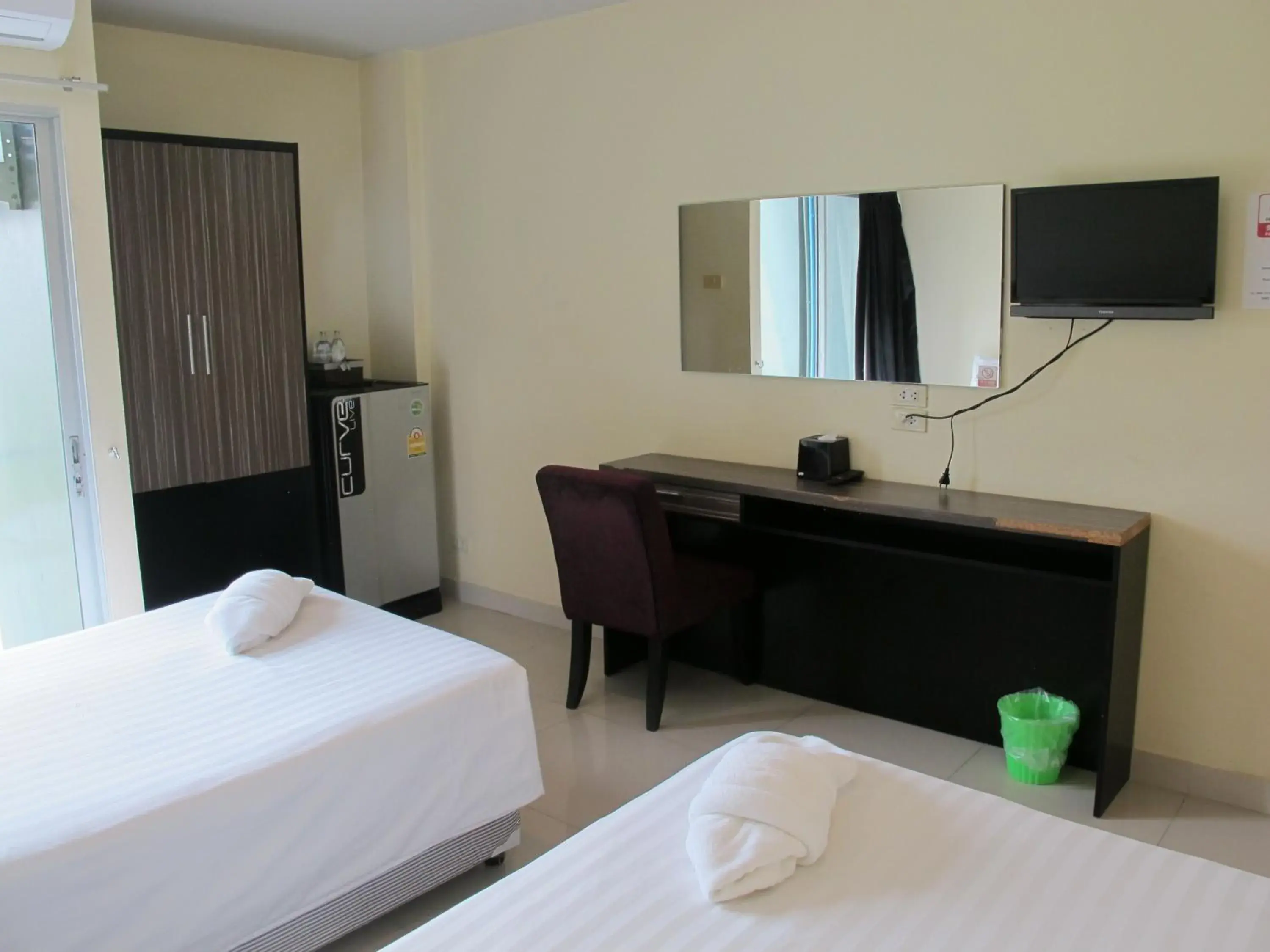 Bed, TV/Entertainment Center in AIRY Suvarnabhumi Hotel