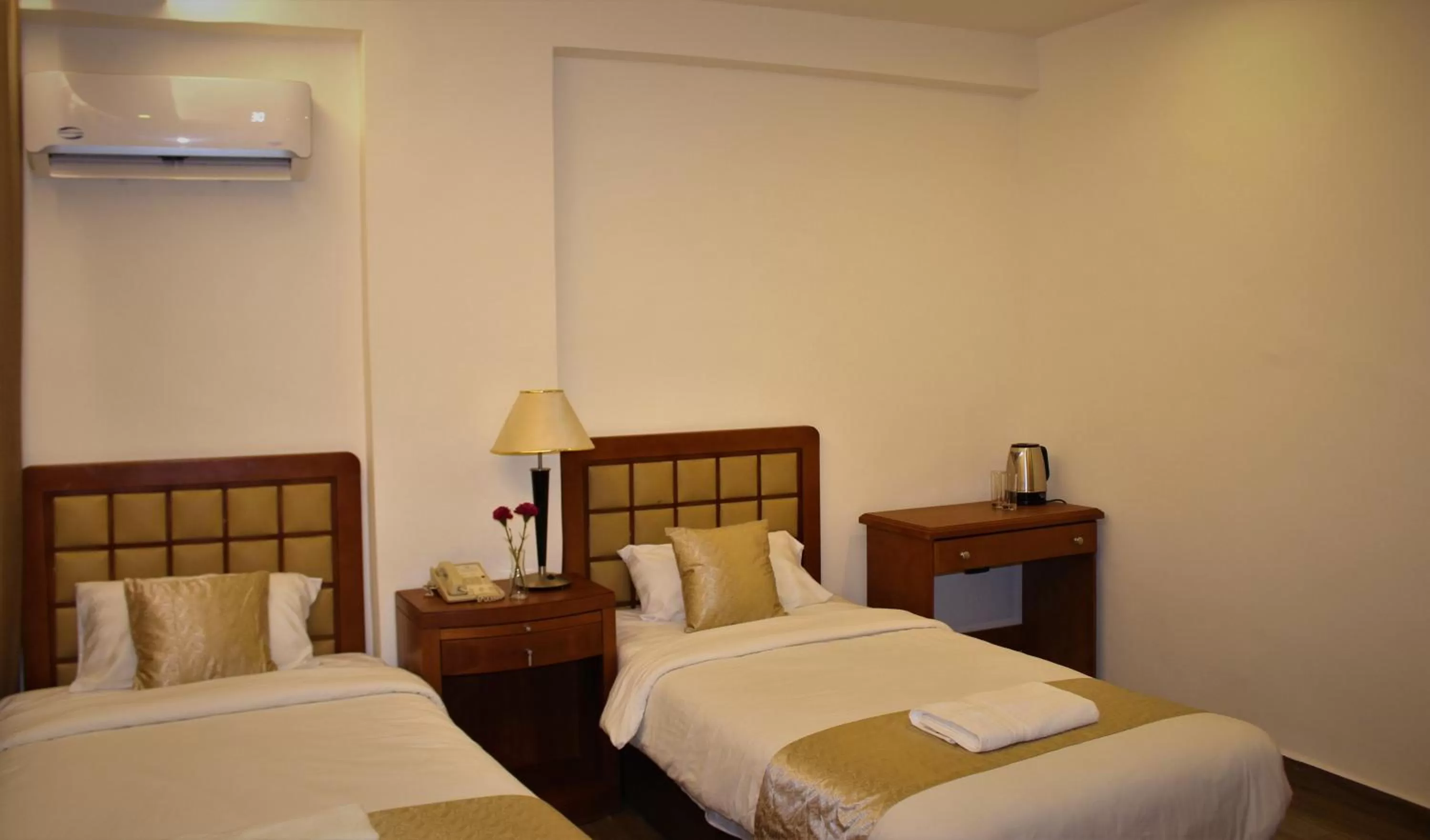 Bed in New MerryLand Hotel