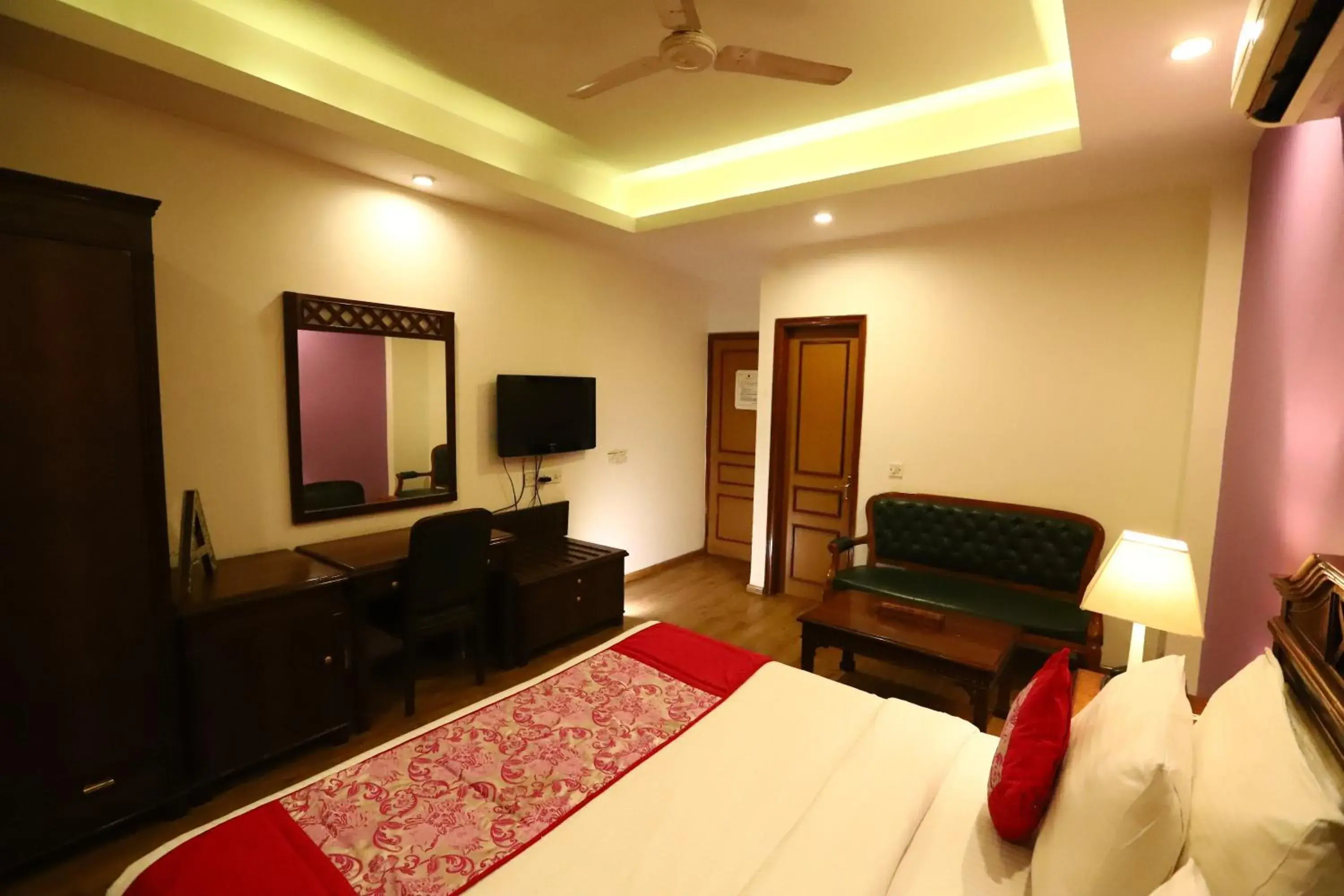 Photo of the whole room, TV/Entertainment Center in Hotel Ambica Palace