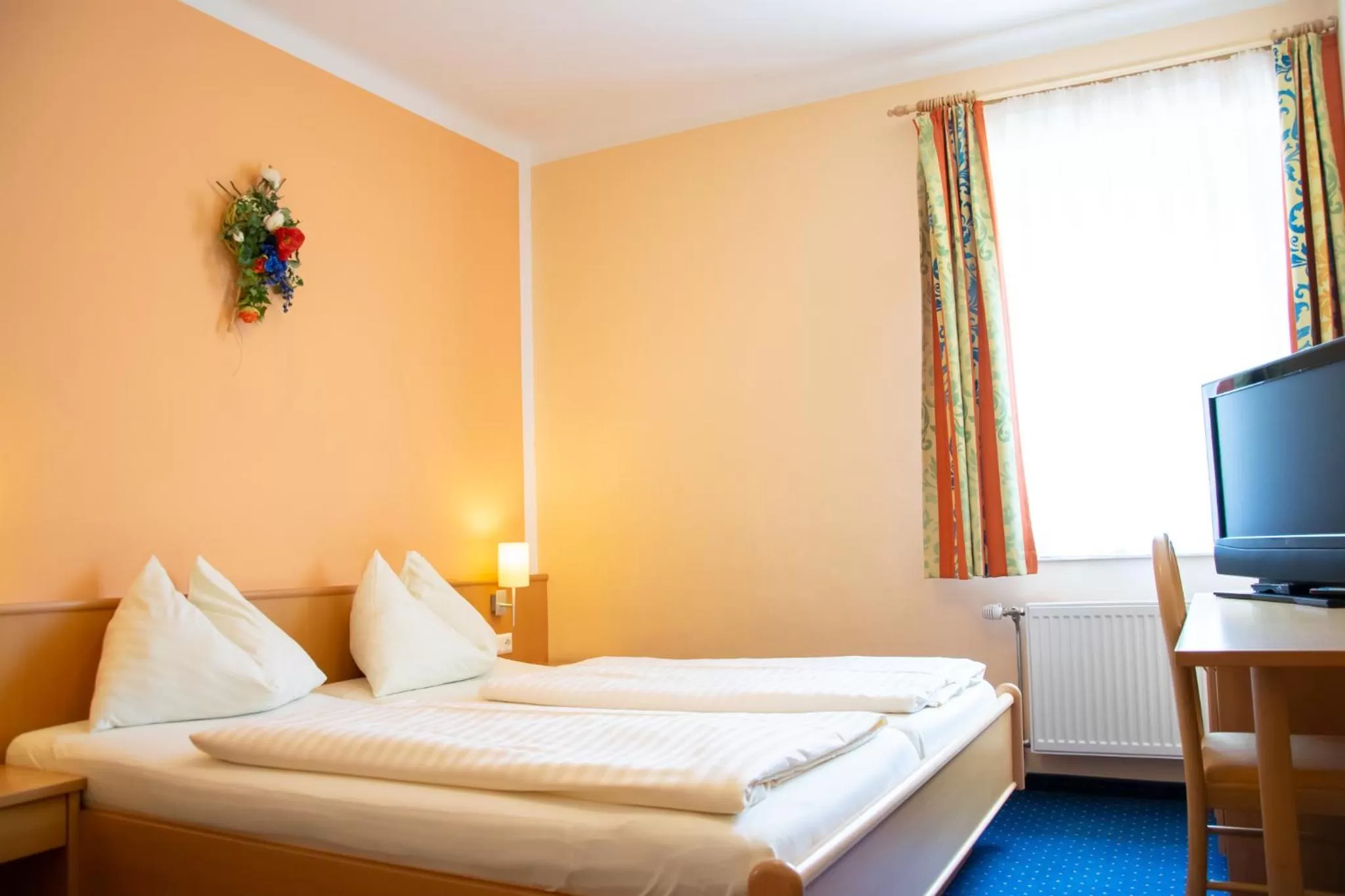 Bed in Strandhotel Burgstaller