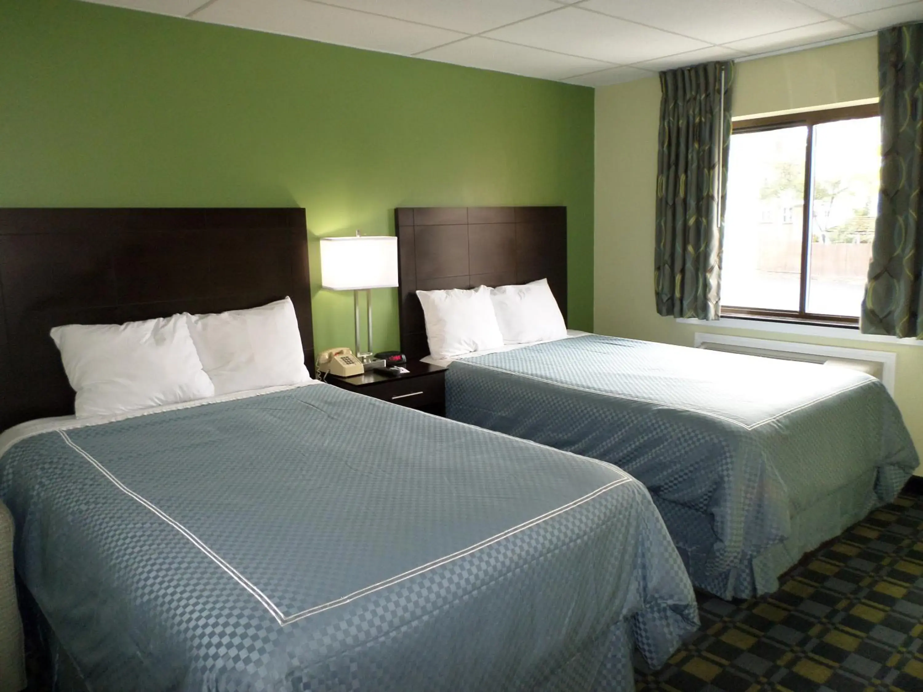 Bed in Travelodge by Wyndham Cleveland Lakewood