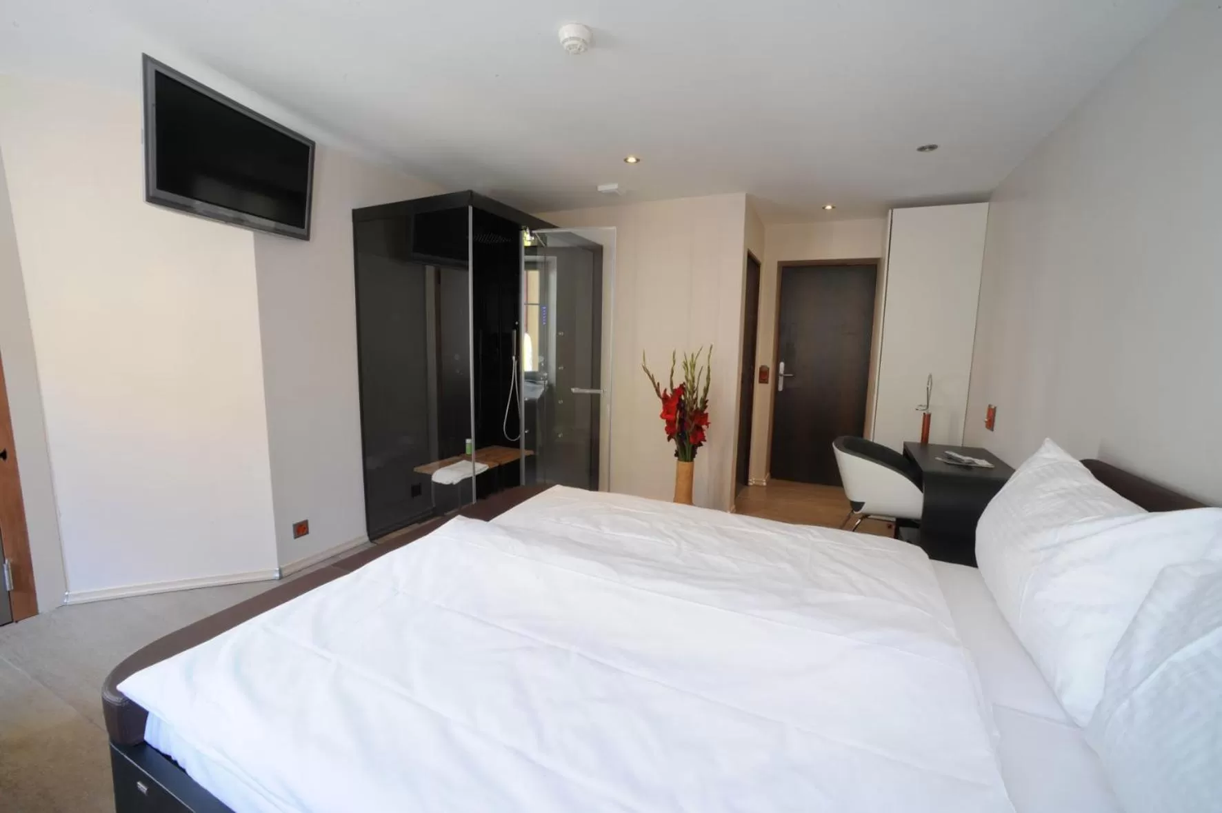 Bed in Chez Gilles hôtel resto bar SA