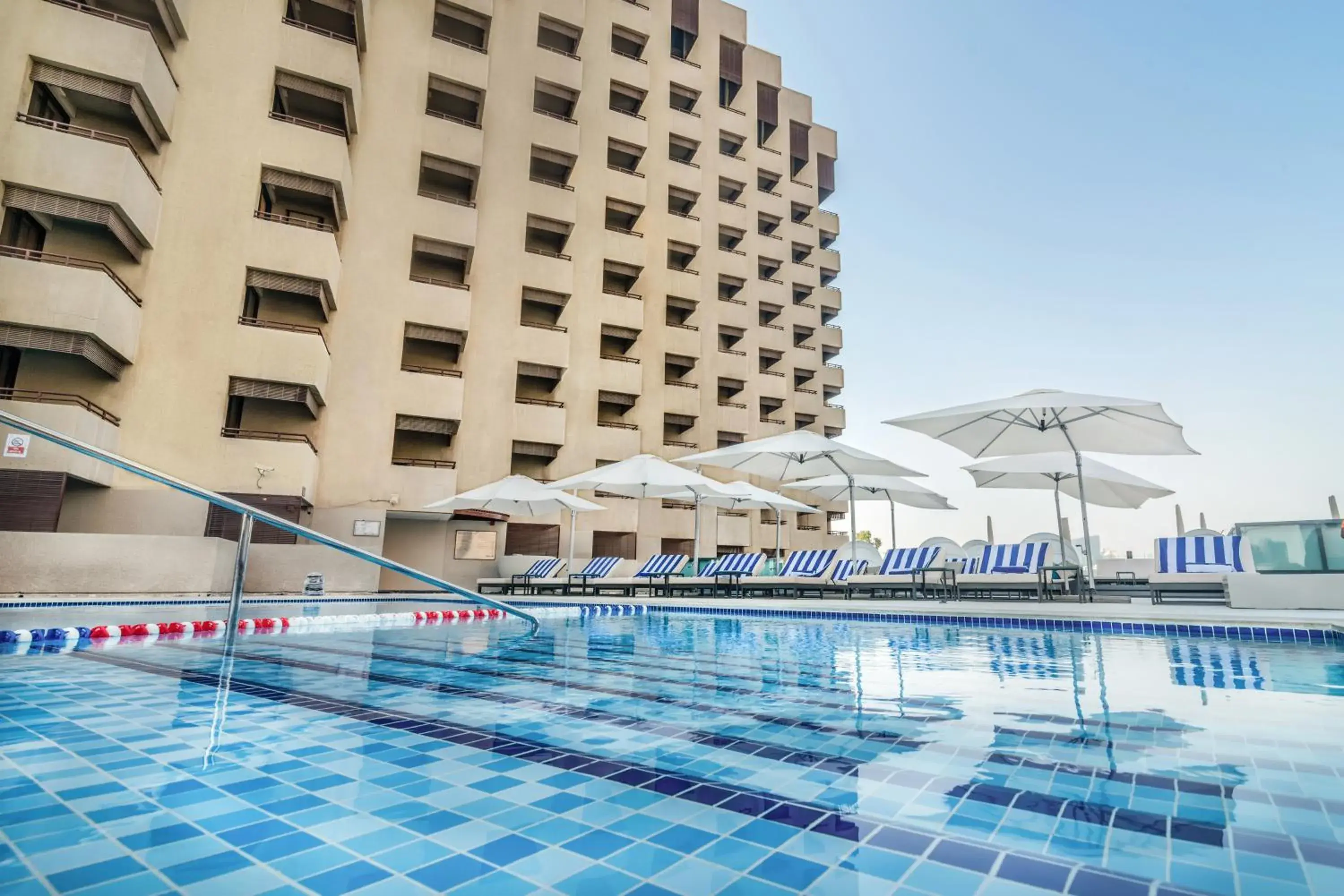 Swimming pool, Property Building in Radisson Blu Hotel, Dubai Deira Creek
