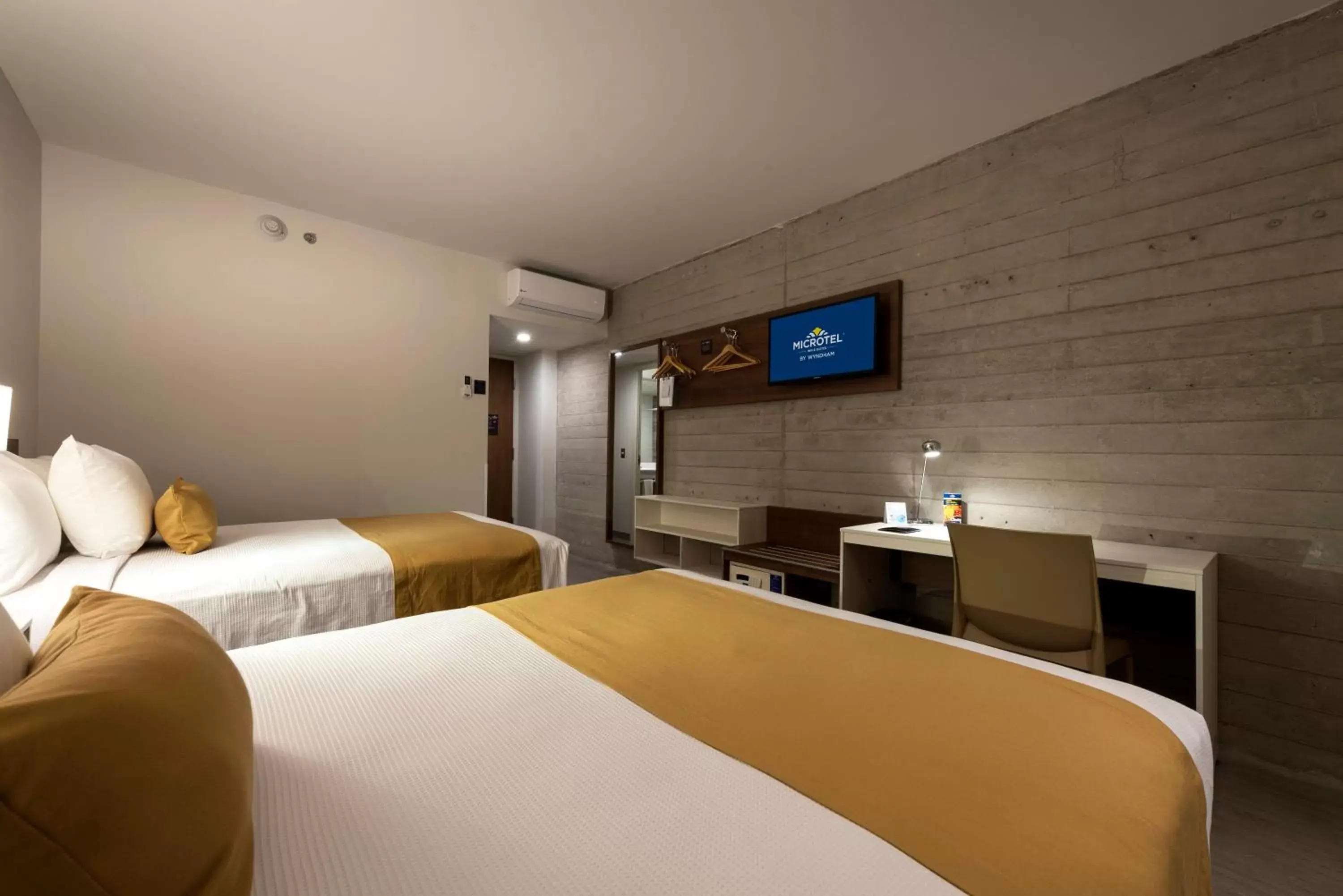 Bed in Microtel Inn & Suites by Wyndham Guadalajara Sur