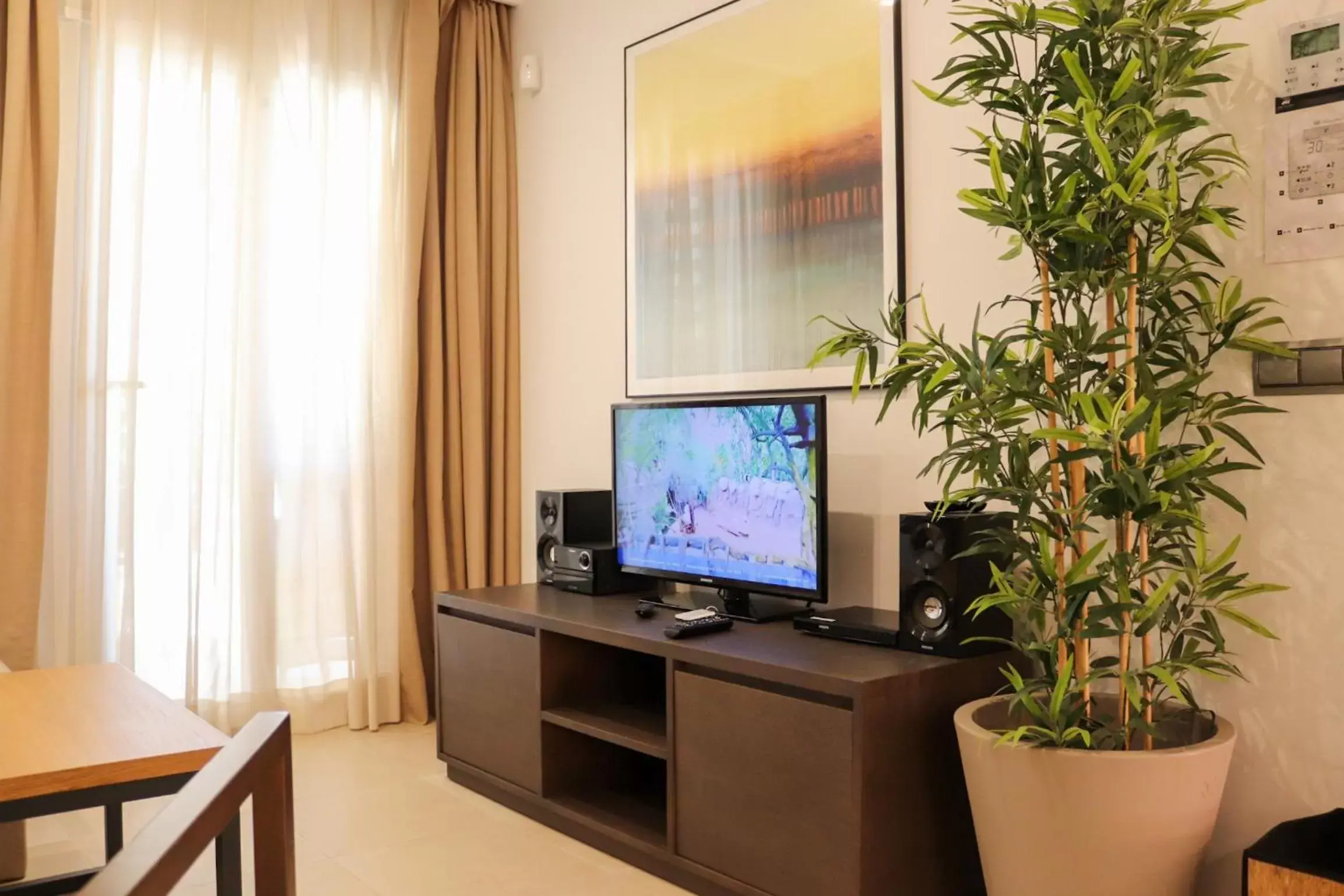 TV and multimedia, TV/Entertainment Center in Ramada Hotel & Suites by Wyndham Costa del Sol