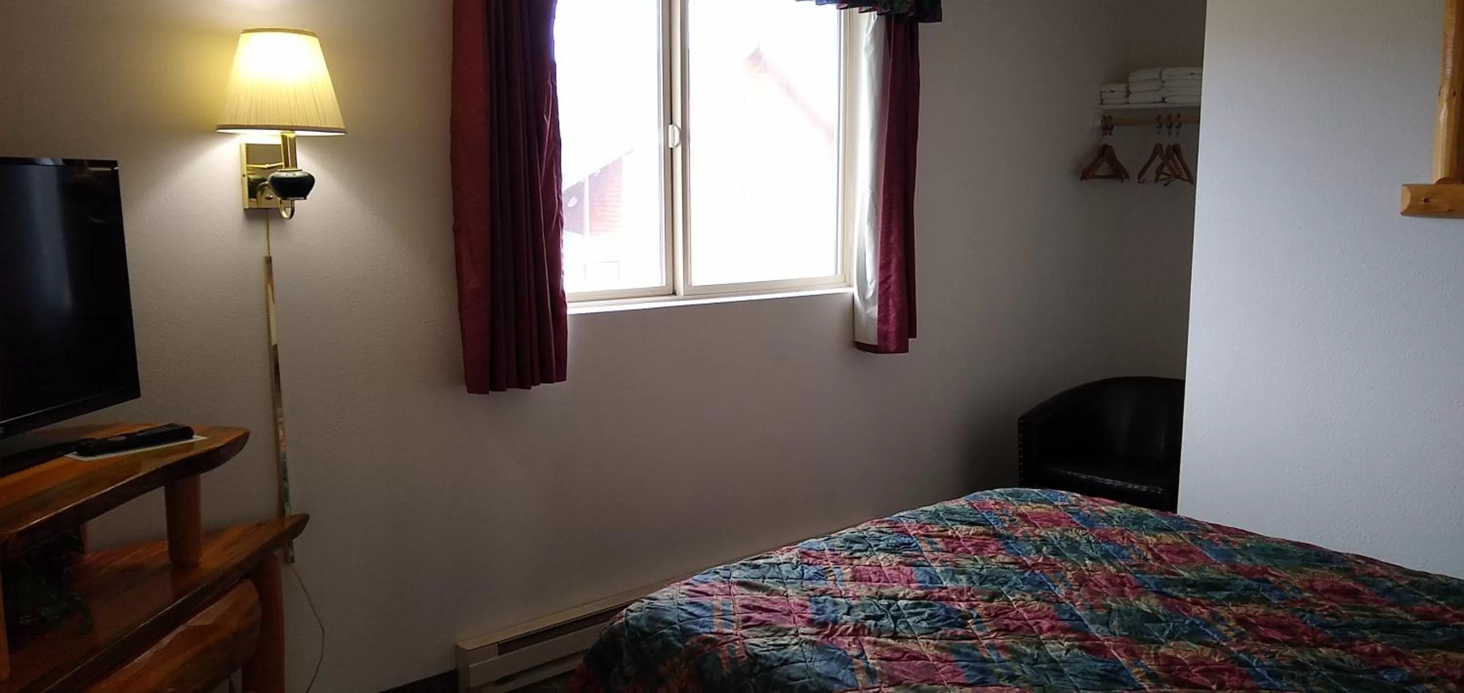 Bed in Ponderosa Motel