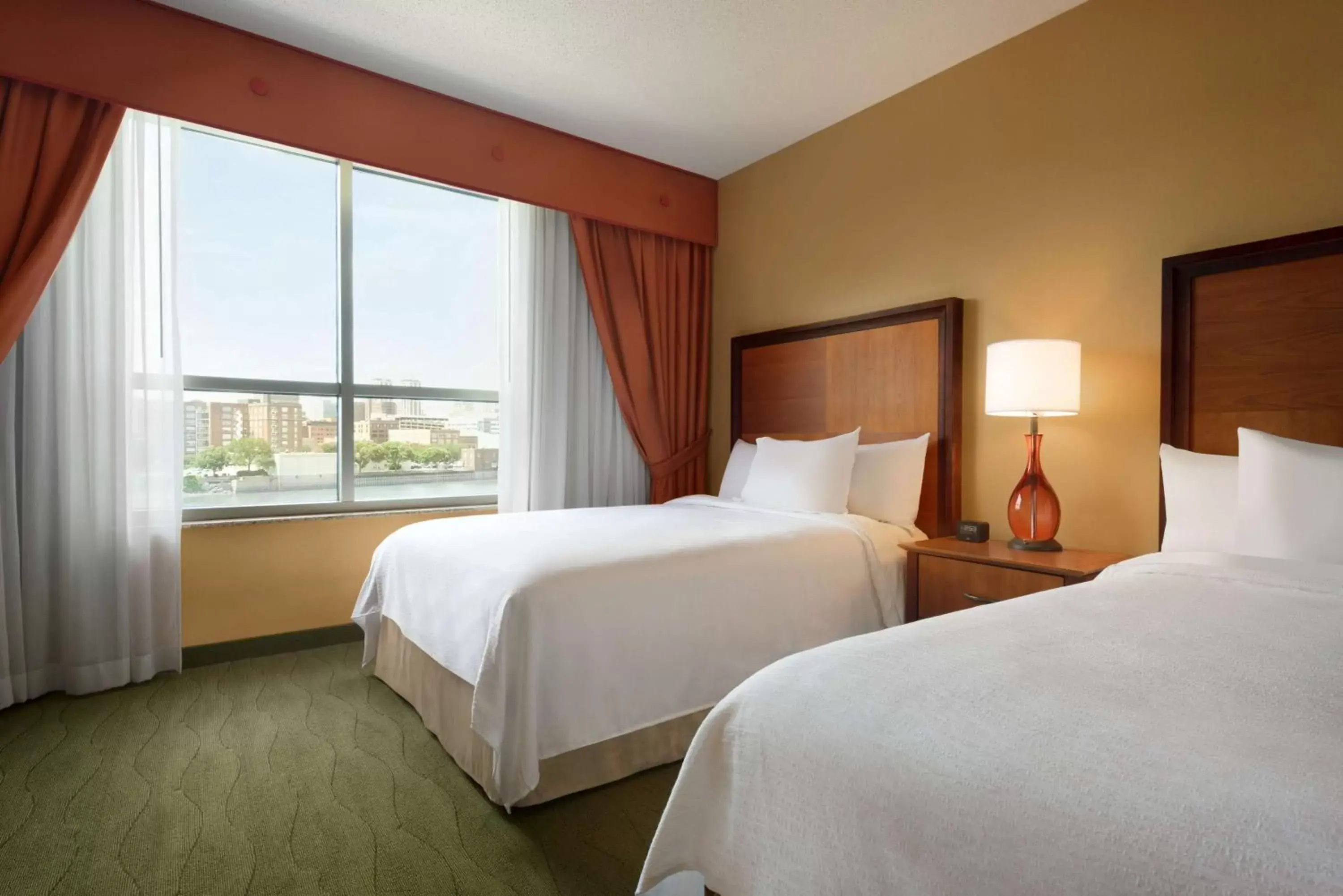 Bed in Embassy Suites East Peoria Hotel and Riverfront Conference Center