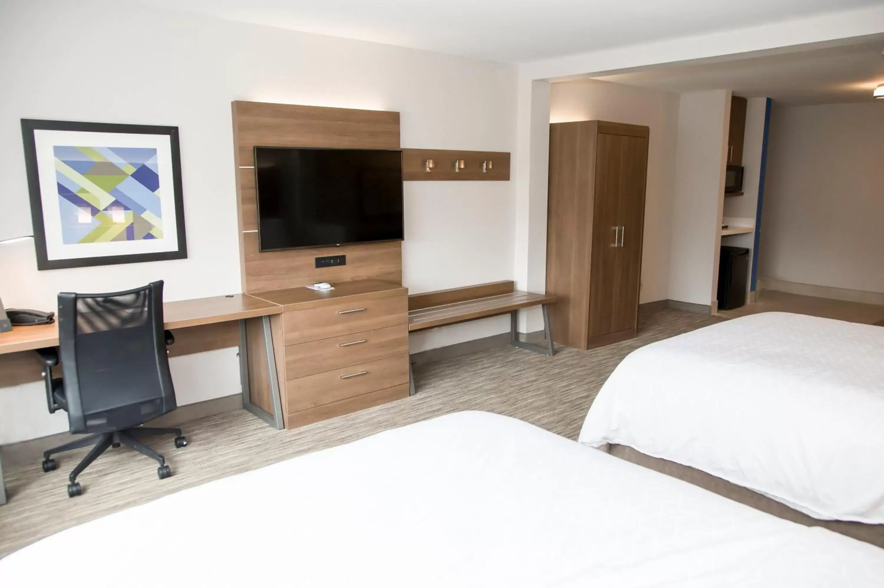 Photo of the whole room, TV/Entertainment Center in Holiday Inn Express & Suites Colorado Springs North, an IHG Hotel