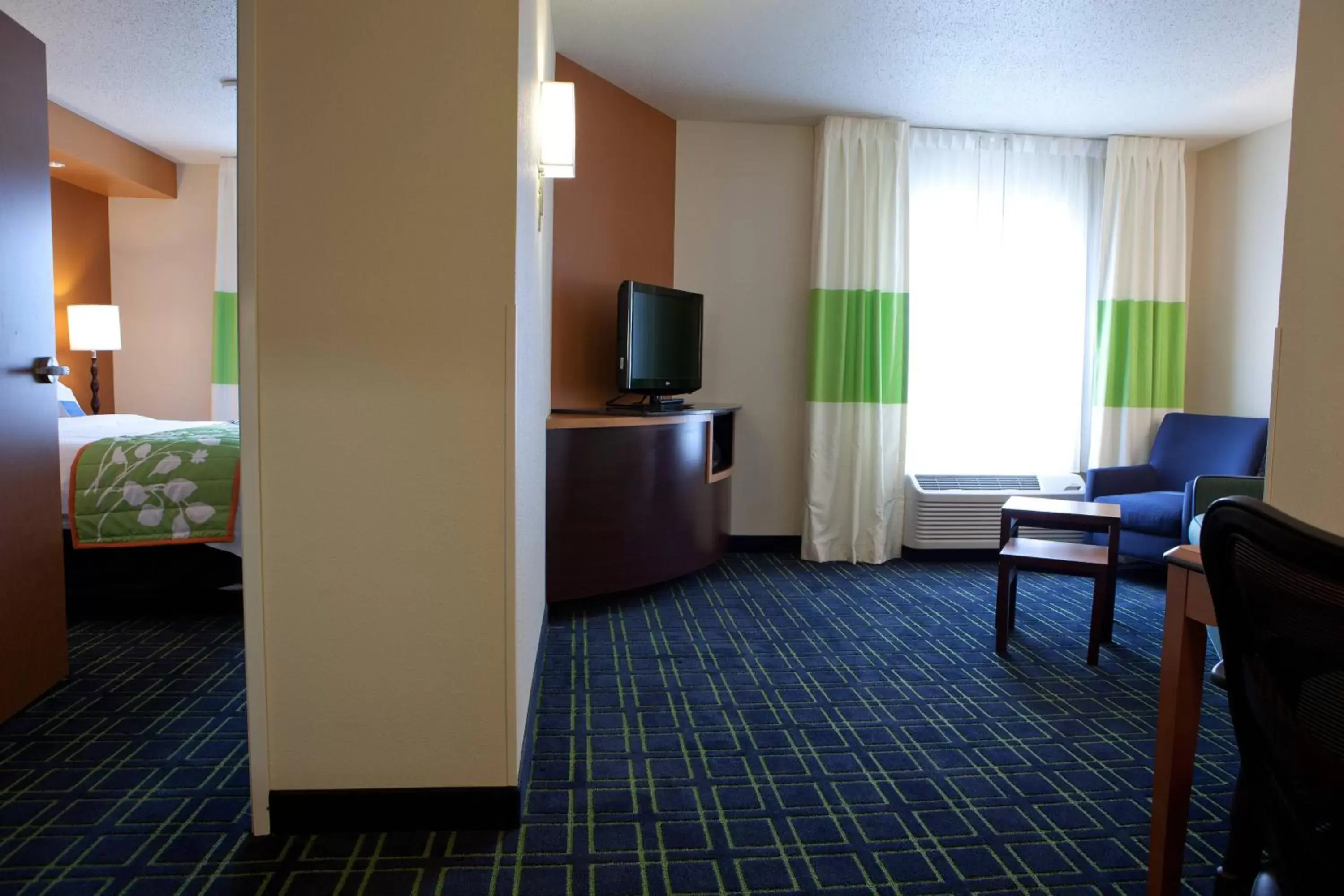 Photo of the whole room, TV/Entertainment Center in Fairfield Inn and Suites Flint Fenton
