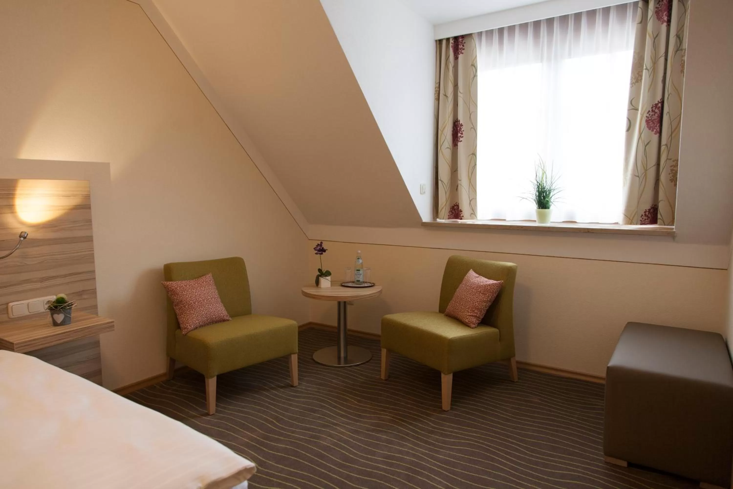 Seating area, Bed in Hotel Straßhof