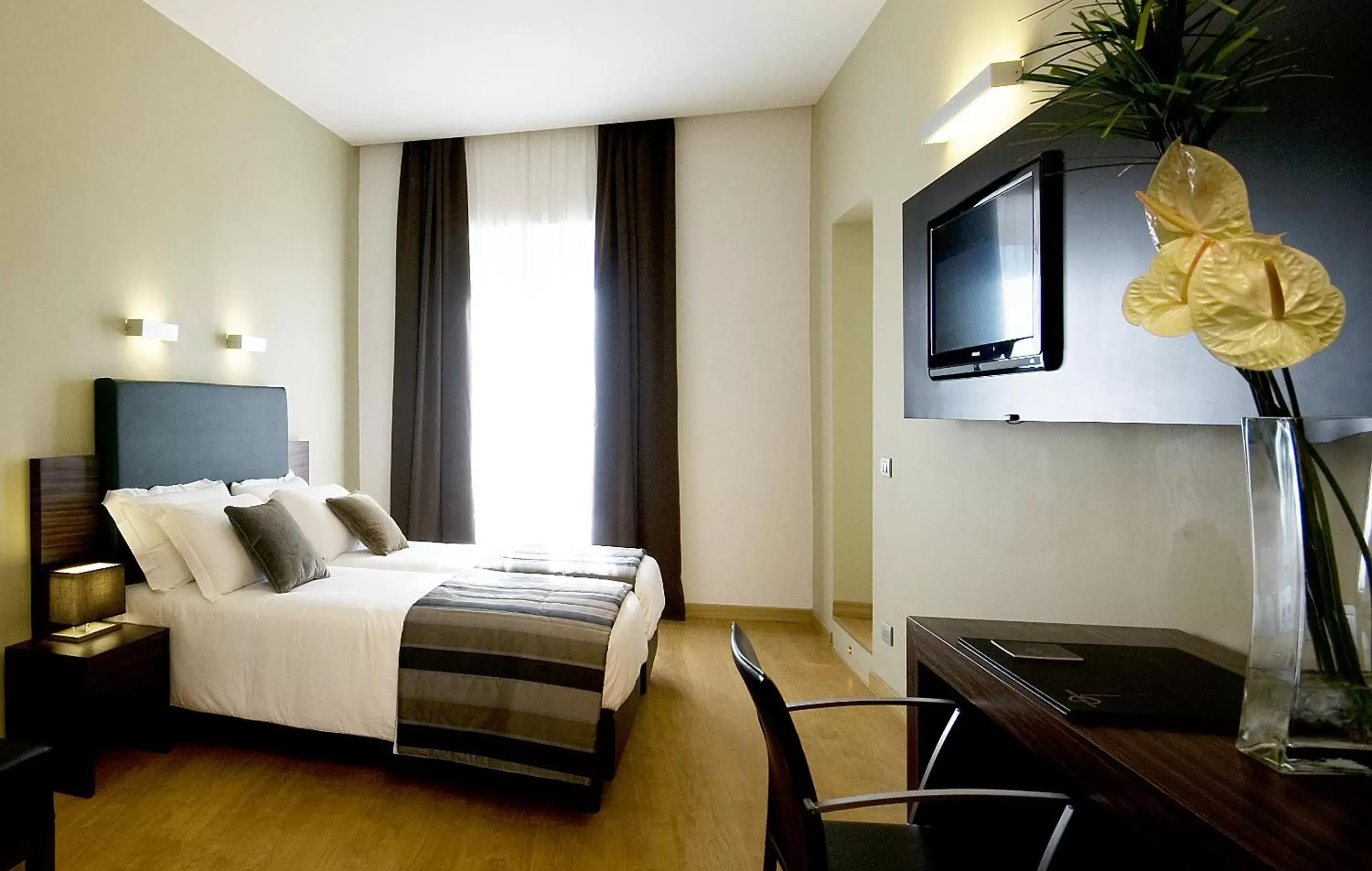 Bed, TV/Entertainment Center in Trevi Collection Hotel - Gruppo Trevi Hotels