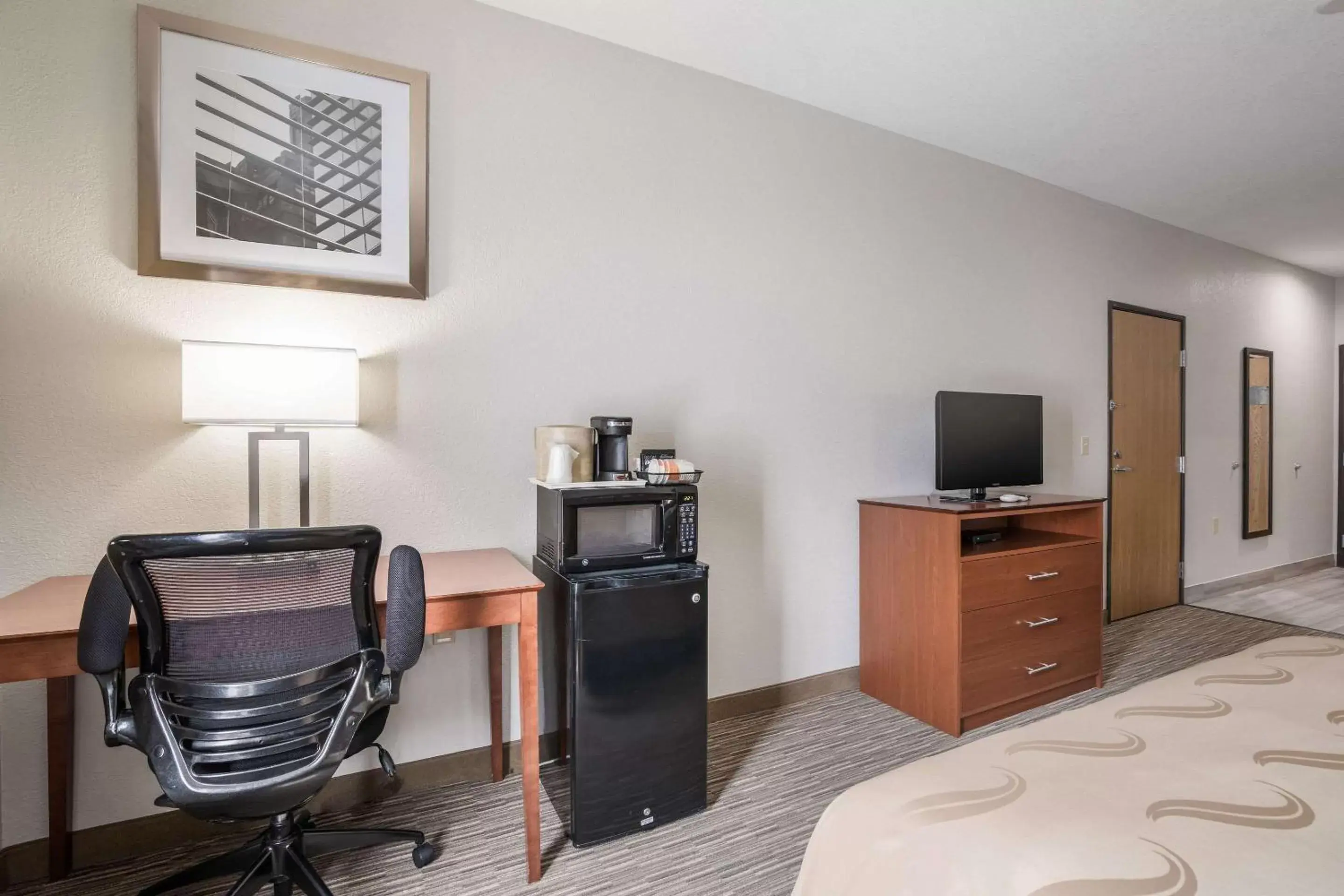 Photo of the whole room, TV/Entertainment Center in Quality Inn & Suites