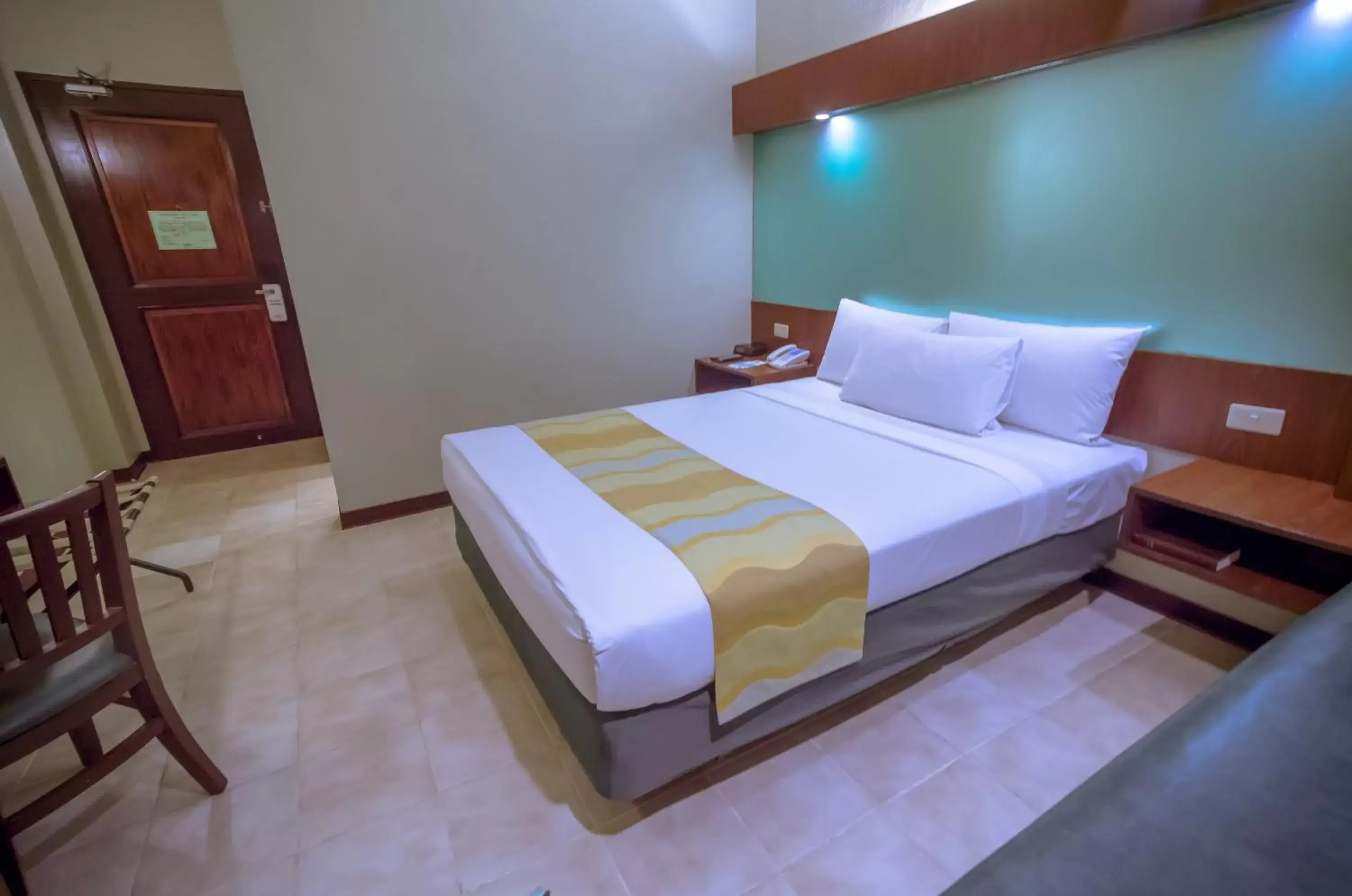 Photo of the whole room, Bed in Microtel by Wyndham Tarlac