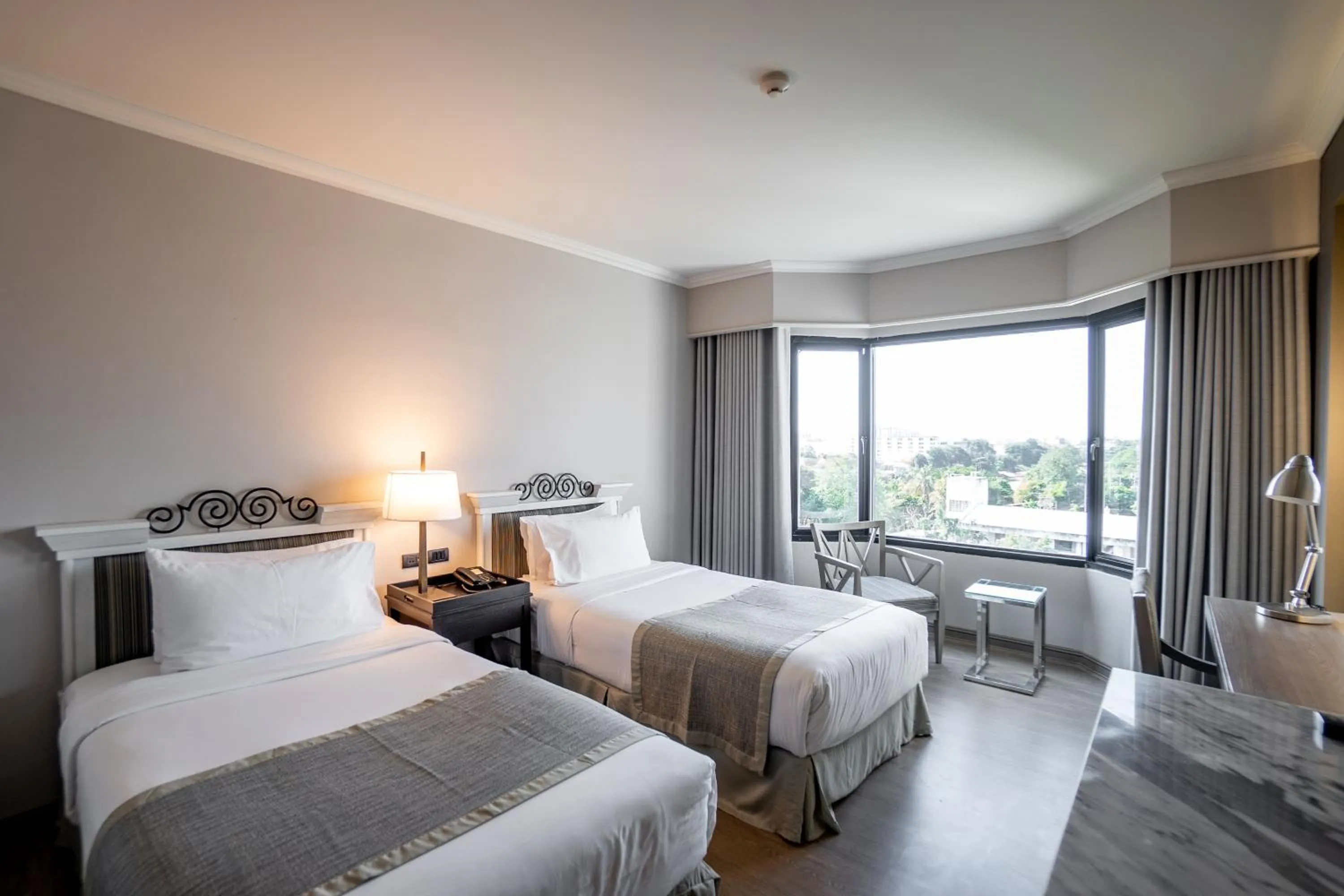 Bed in The Grand Riverside Hotel