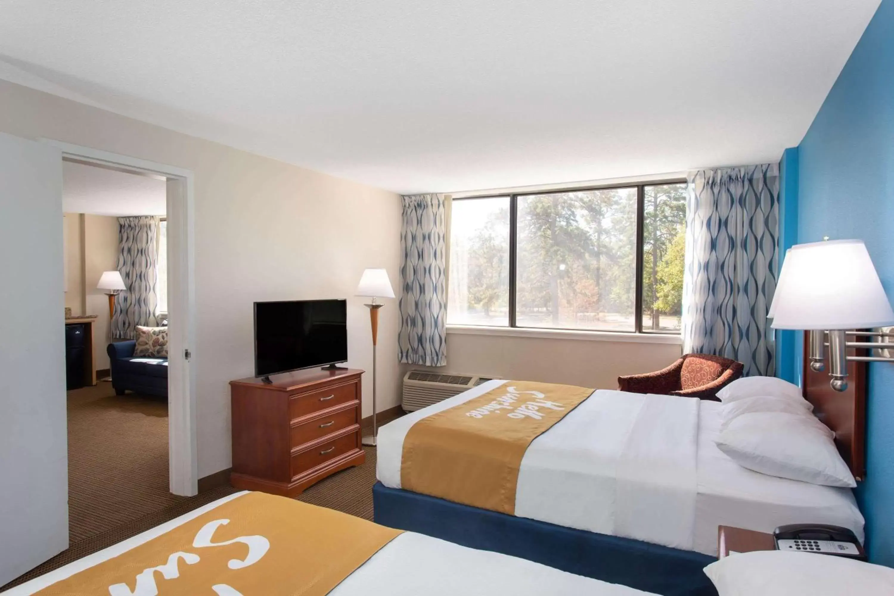 Photo of the whole room, Bed in Days Inn & Suites by Wyndham Tallahassee Conf Center I-10