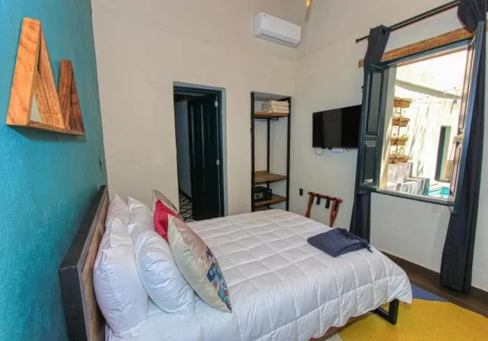 Bed in Antigua Trece Hotel Fusión