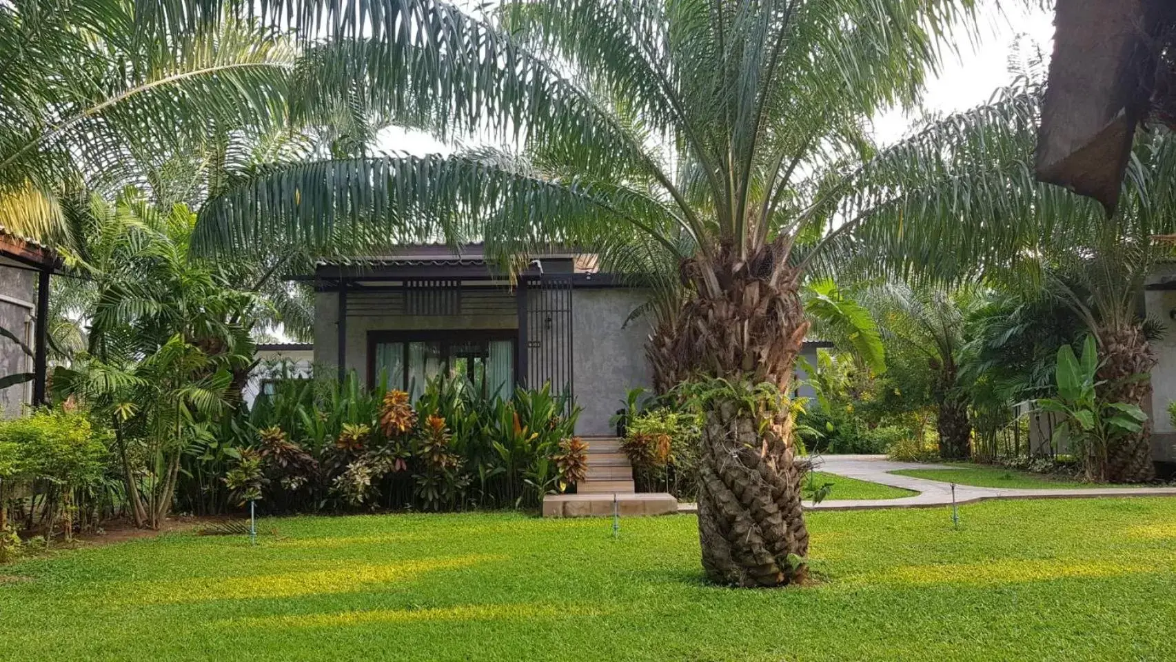 Property building, Garden in Palm Pran Resort