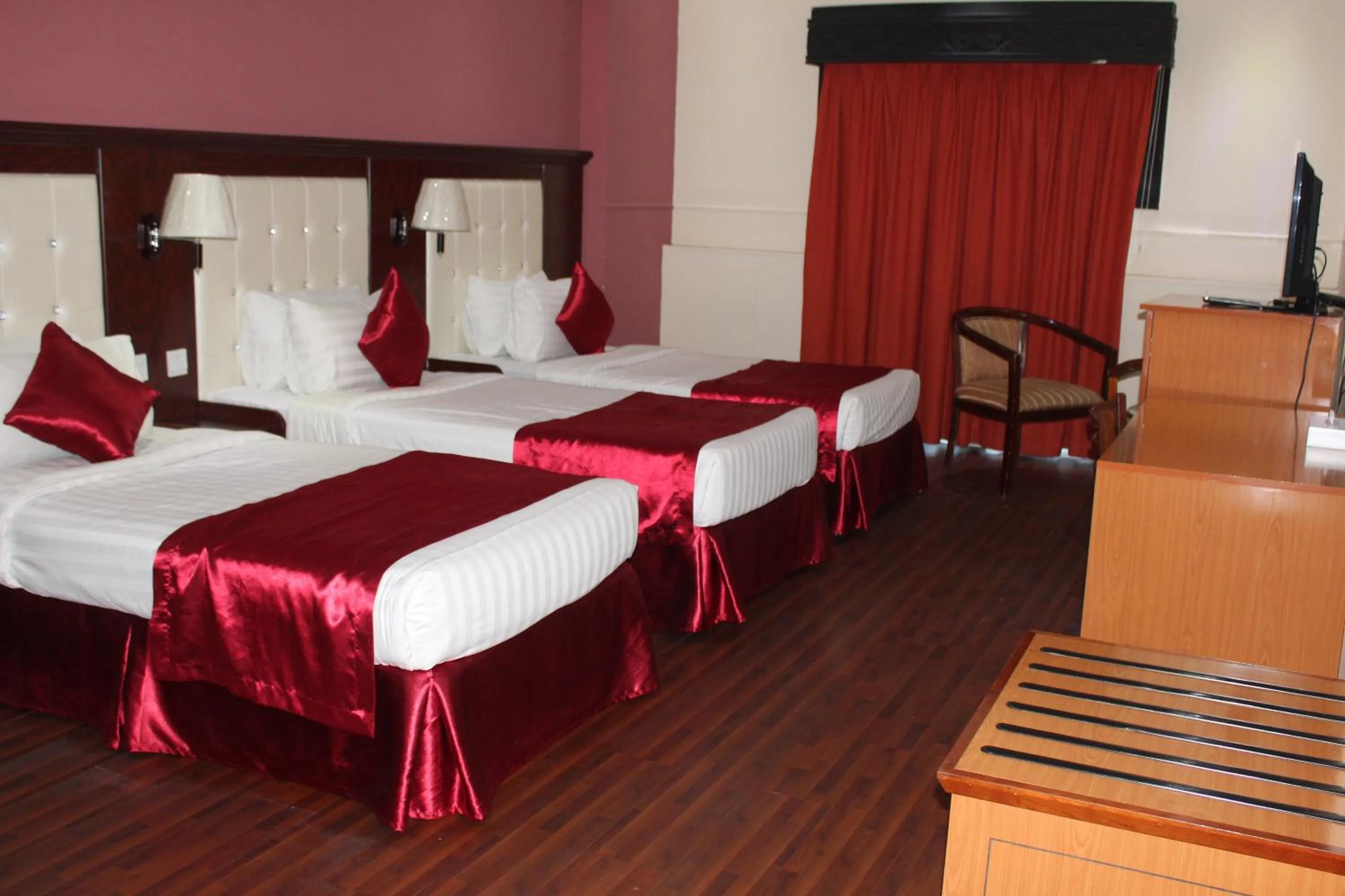 Bed in Grand Nova Hotel