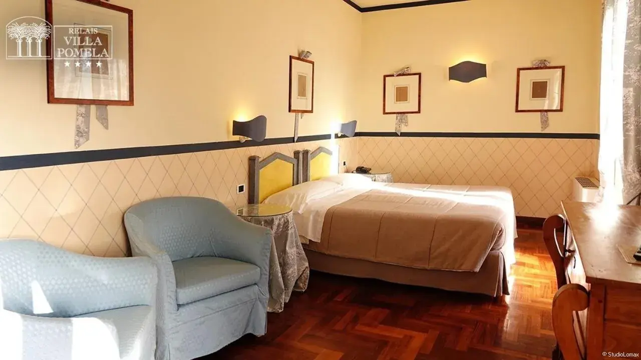 Bed in Relais Villa Pomela