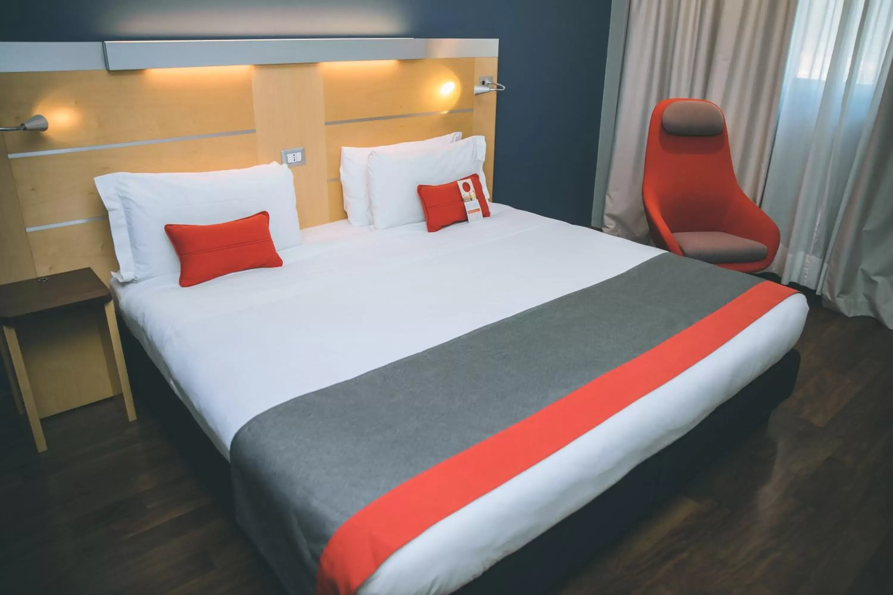 Bed in Holiday Inn Express Milan-Malpensa Airport, an IHG Hotel