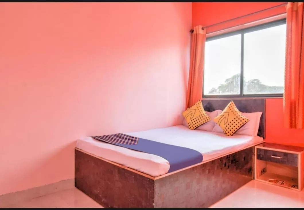 Bed in Hotel Nisarg Lodging And Restaurant