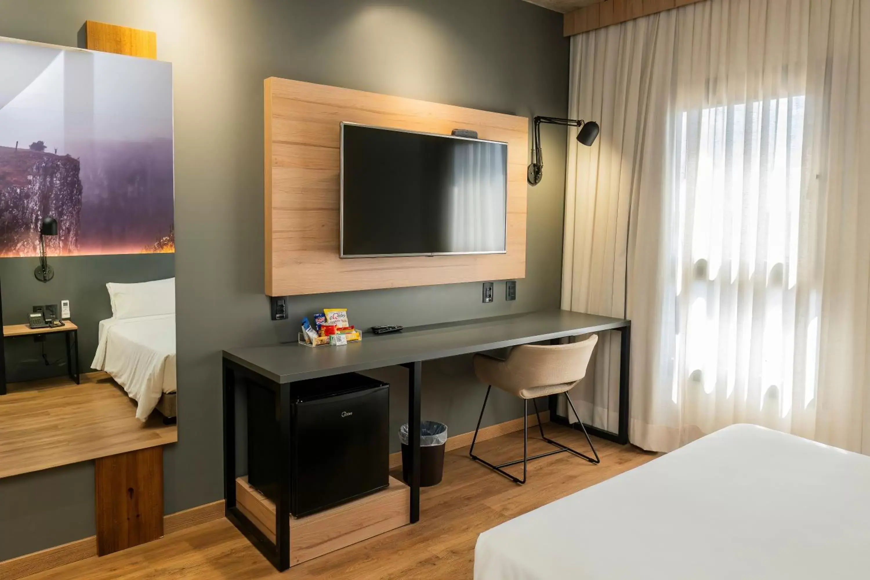 Bed, TV/Entertainment Center in Novotel Criciuma