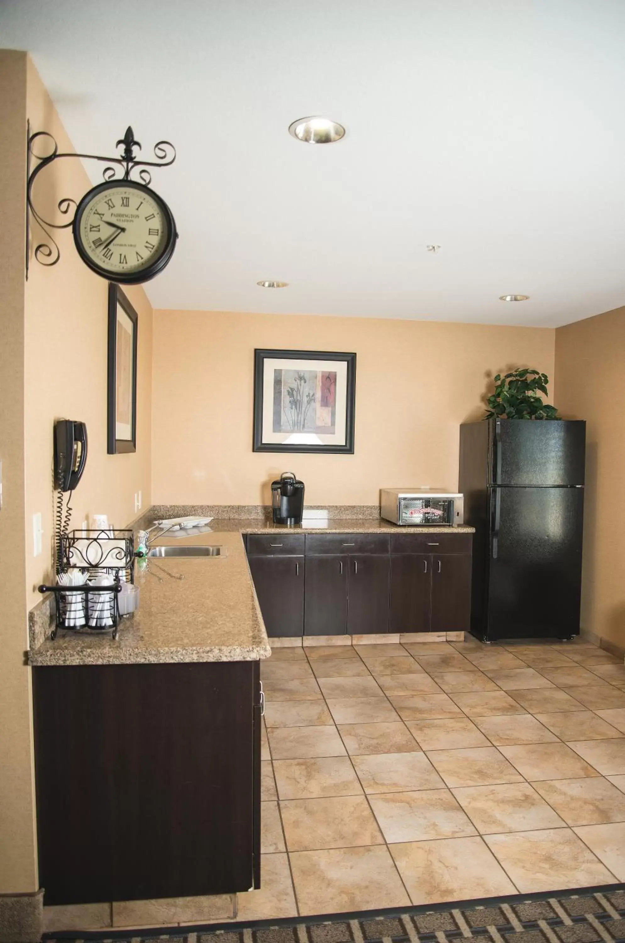 Meeting/conference room, Kitchen/Kitchenette in Candlewood Suites Loveland, an IHG Hotel