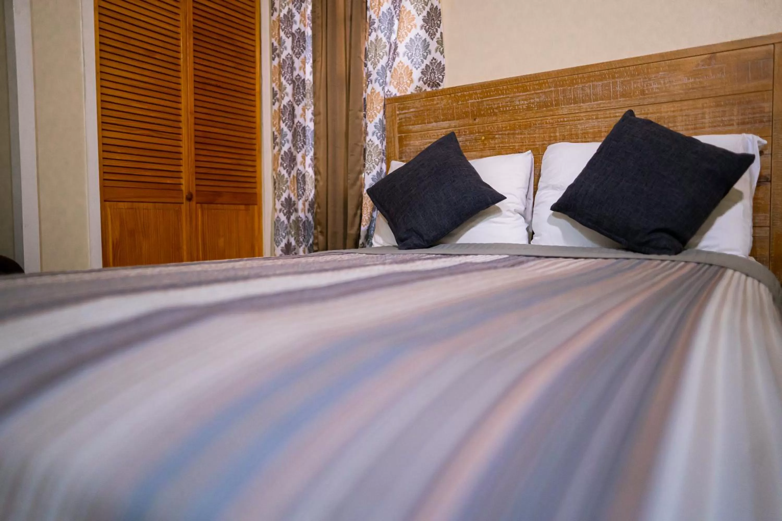 Bed in Connie's Comfort Suites