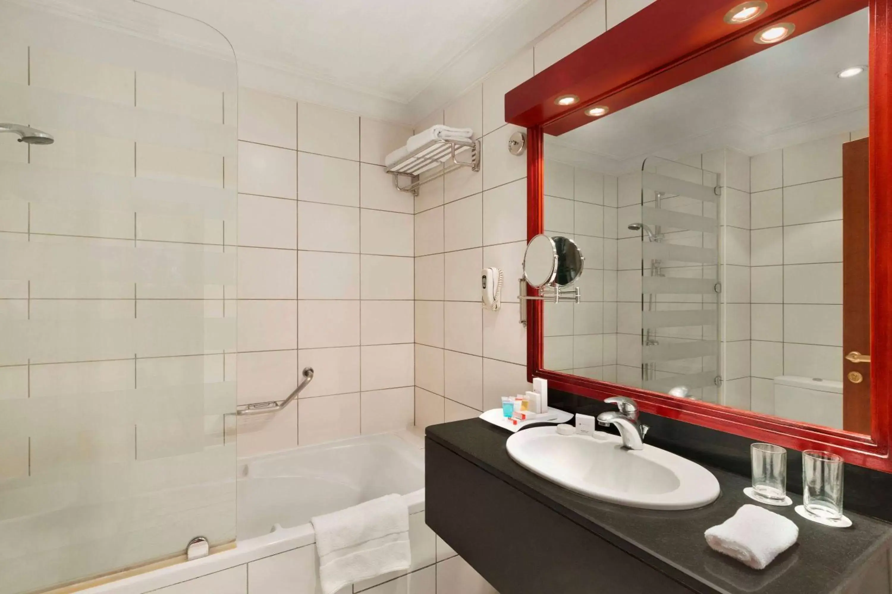 TV and multimedia, Bathroom in Ramada by Wyndham Hotel Riyadh