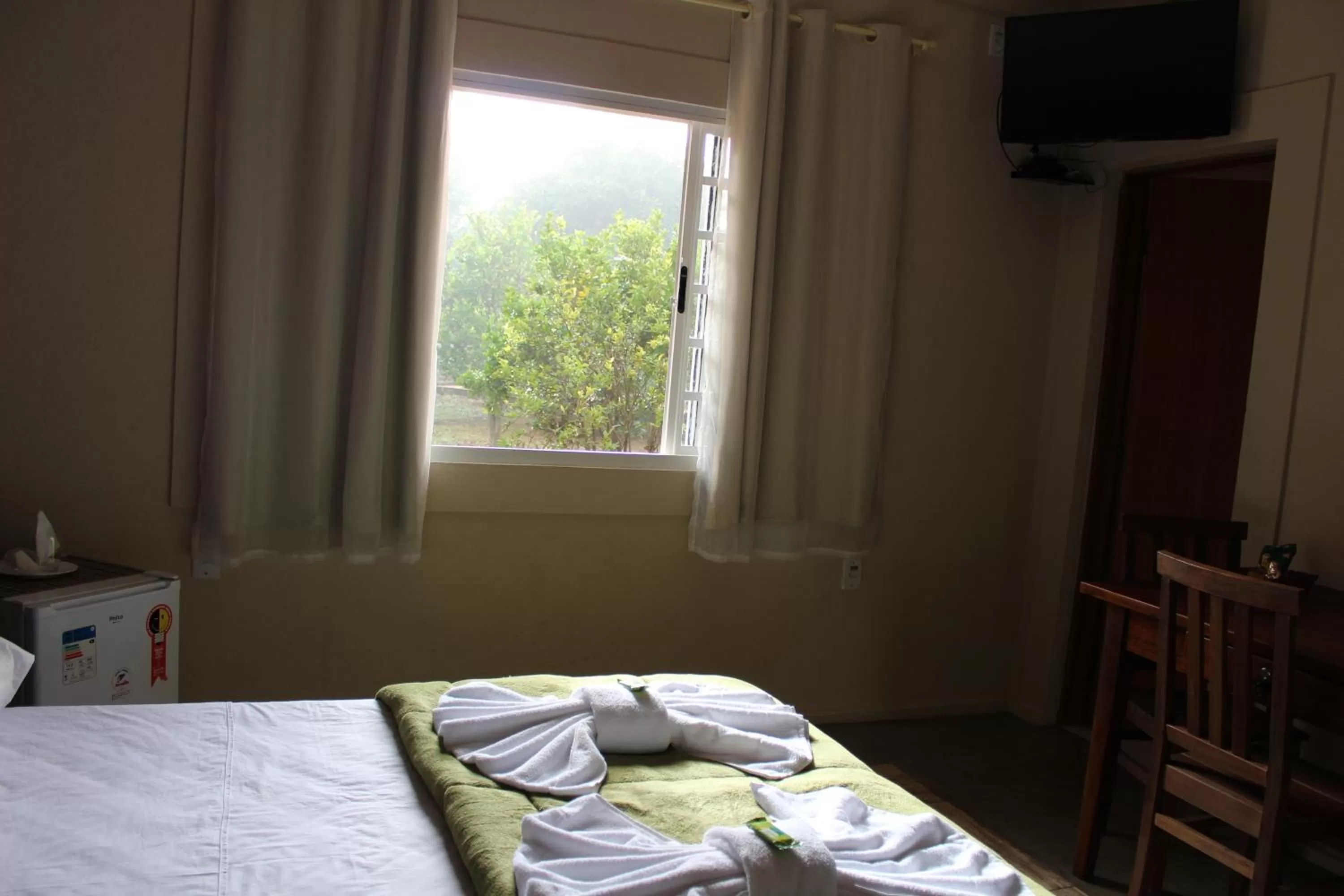 Bed in Pousada Morro dos Ventos