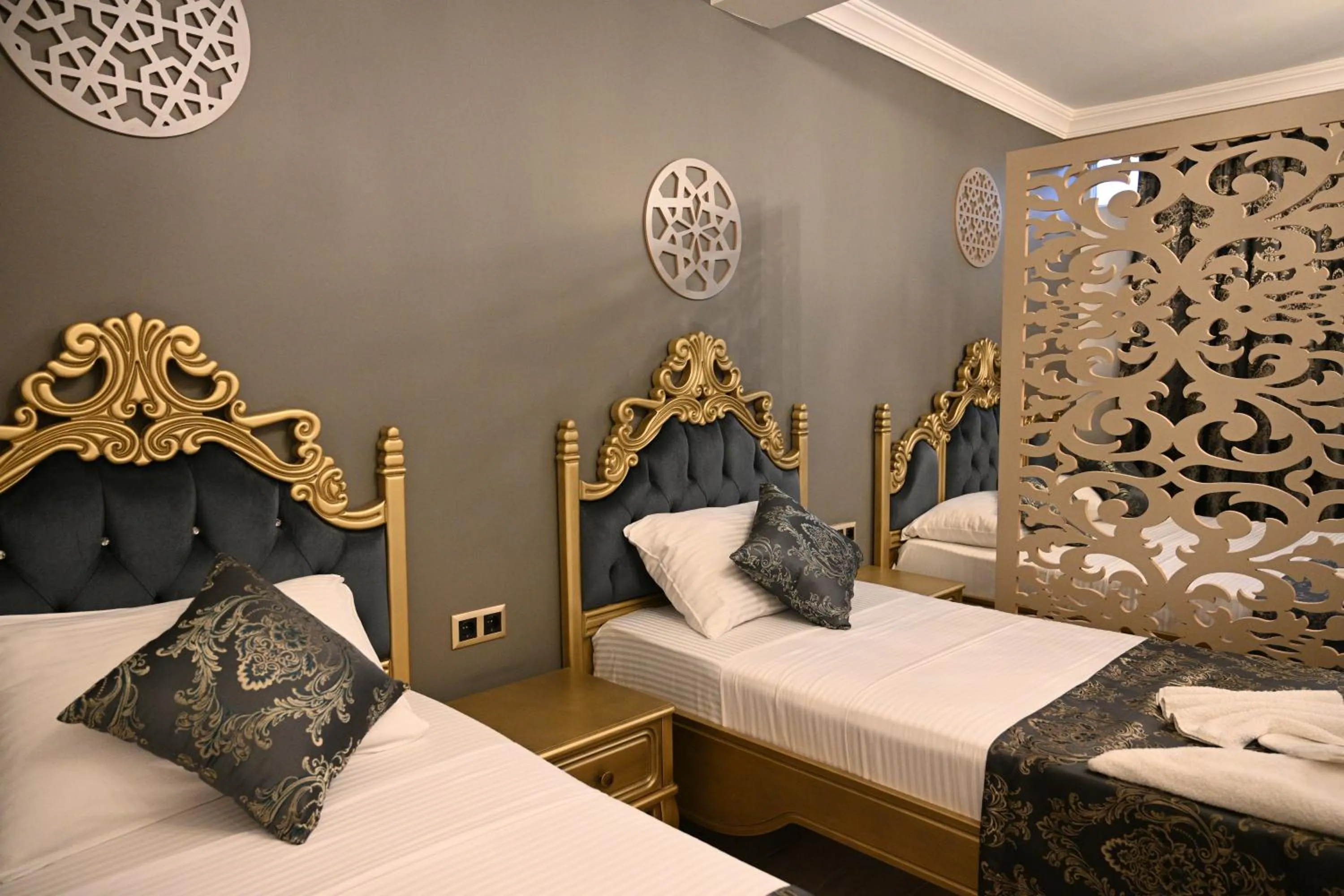 Bed in Ethnica Suites