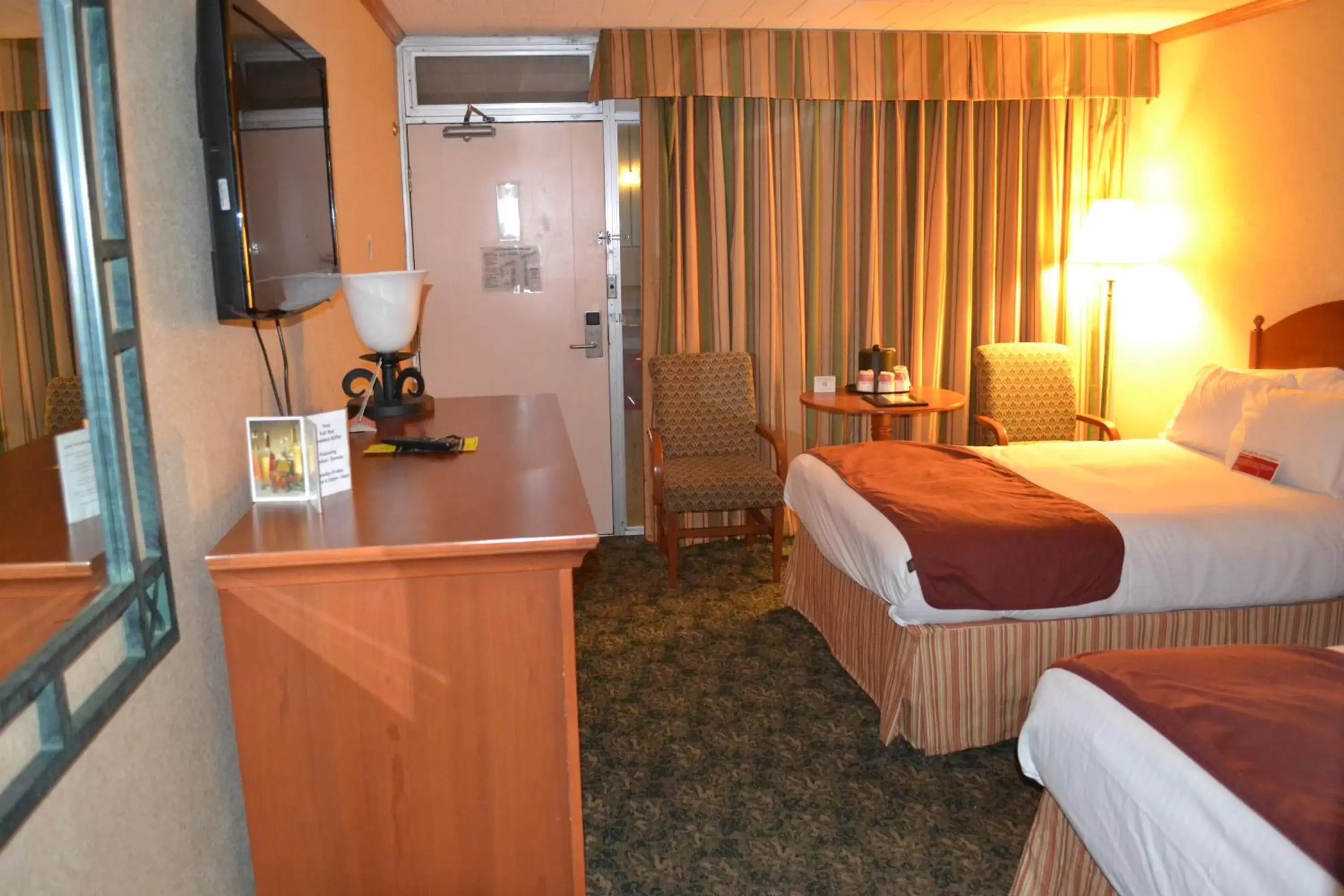 Bed in Ramada by Wyndham State College Hotel & Conference Center