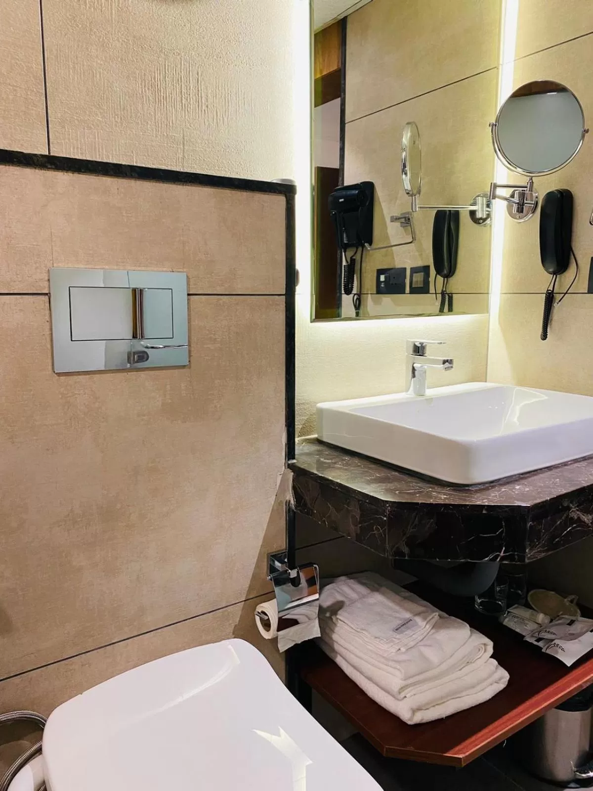 Bathroom in Royal Plaza Suites by RAK Rooms, Mangaluru