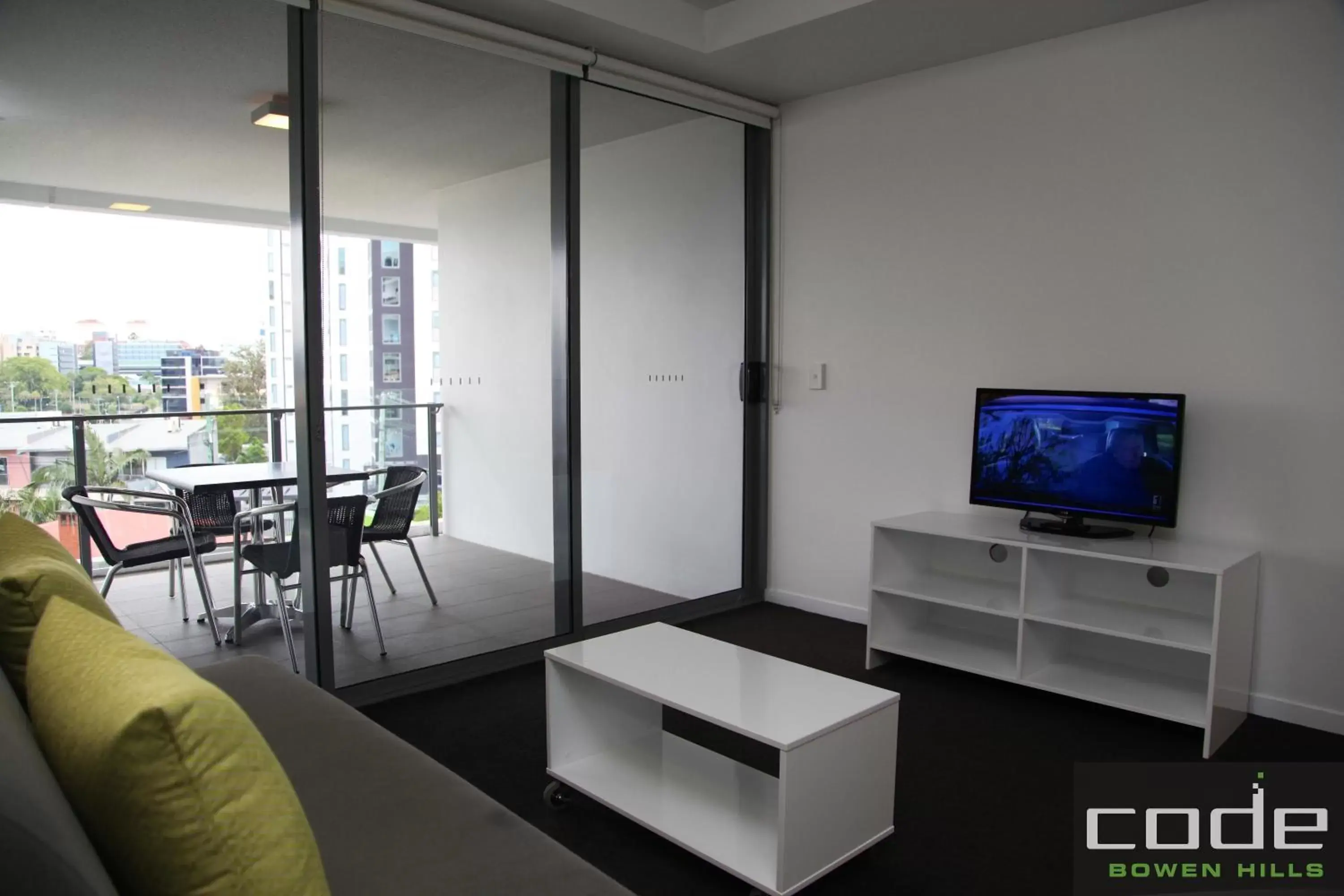 Living room, TV/Entertainment Center in Code Apartments