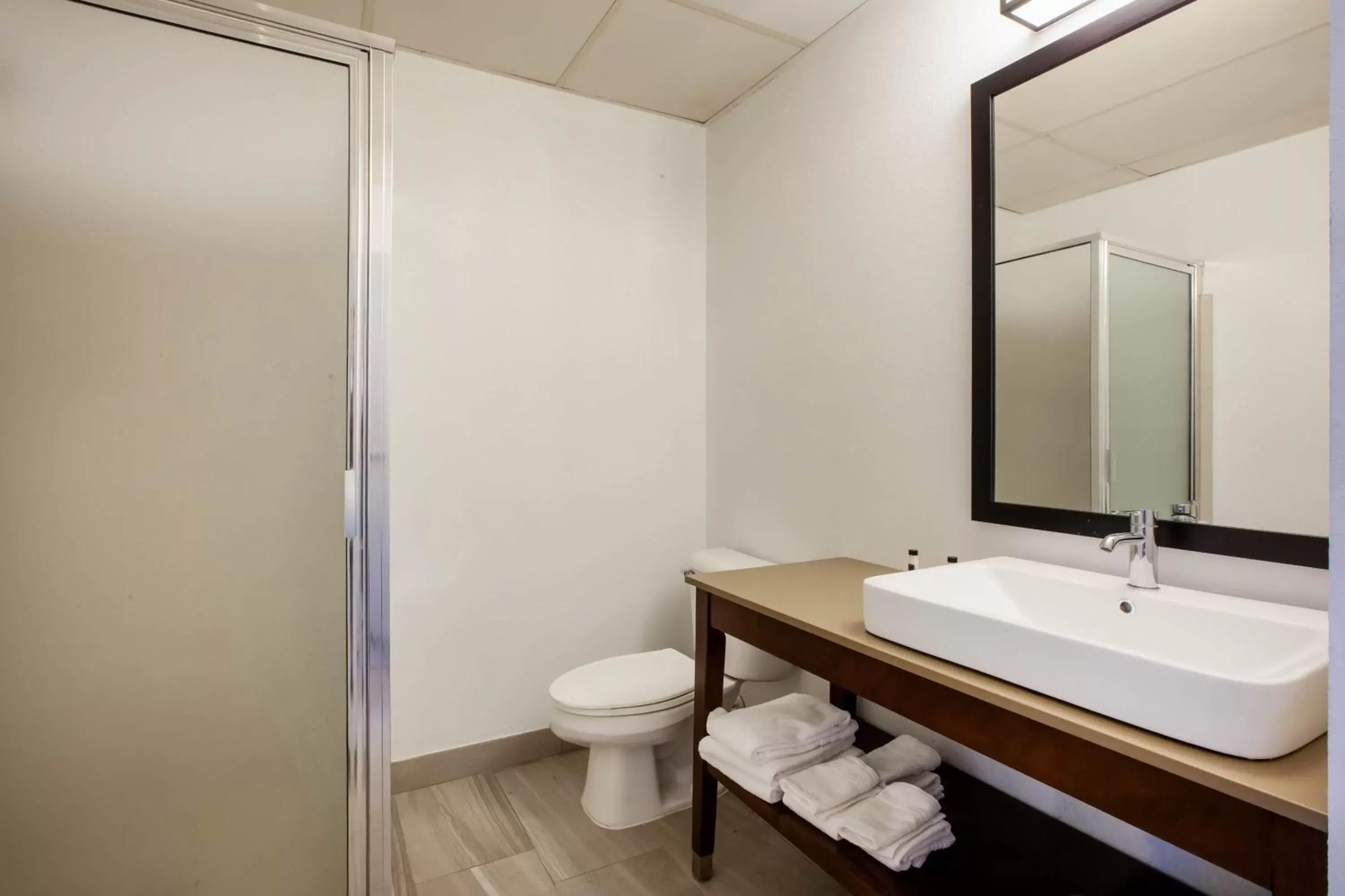 Bathroom in Days Inn & Suites by Wyndham Rochester Hills MI