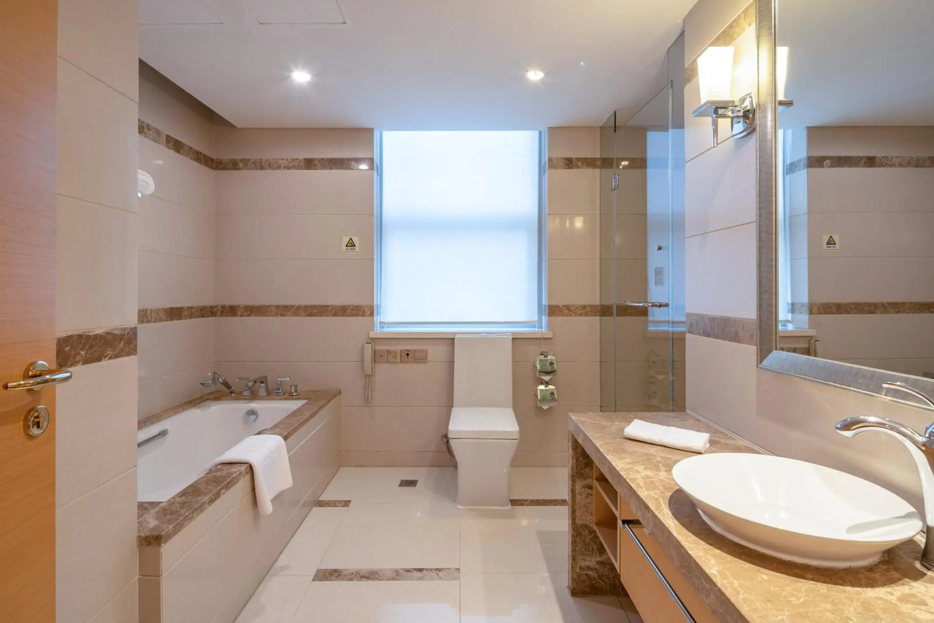 Bathroom in Regal Plaza Hotel & Residence