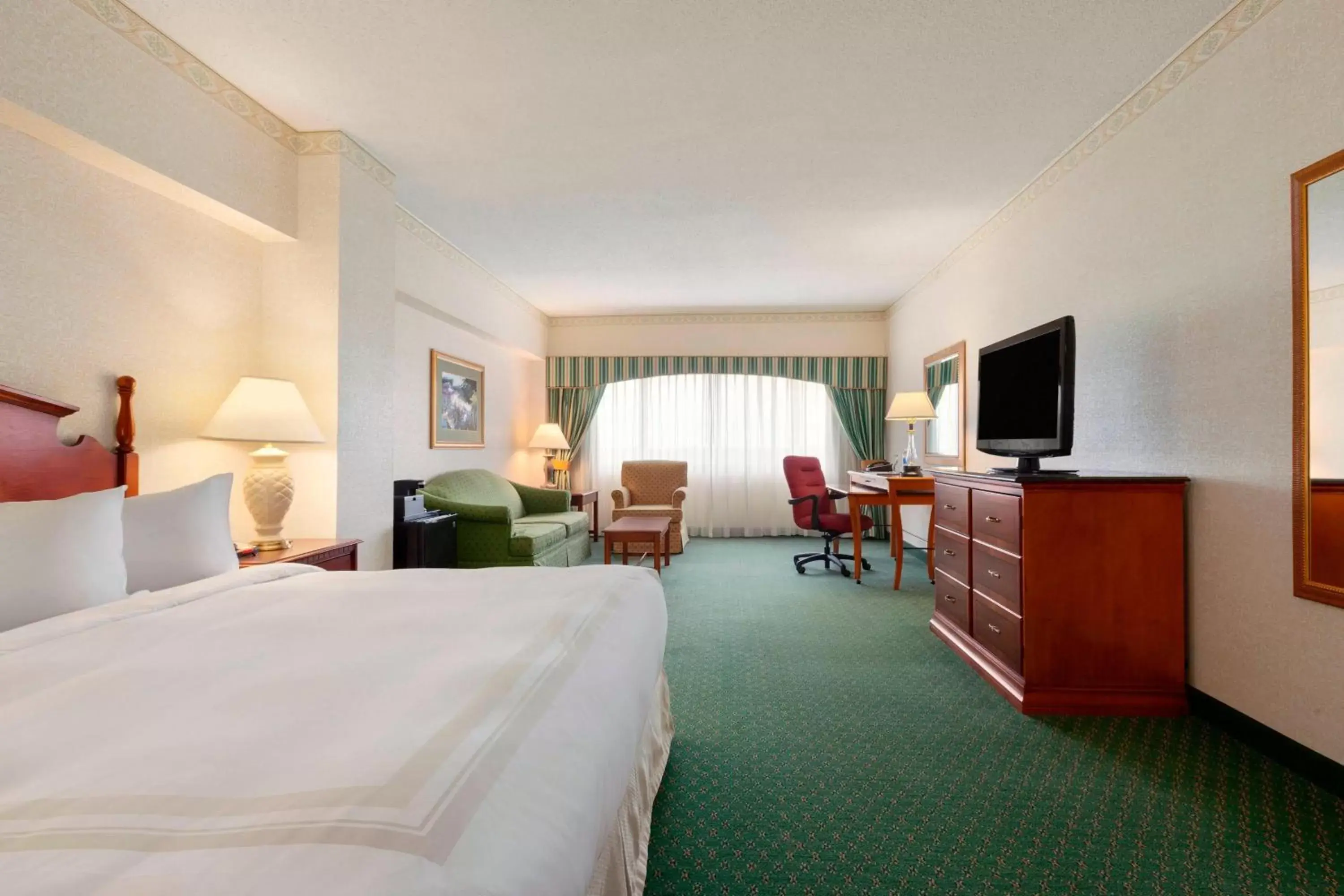 Photo of the whole room, TV/Entertainment Center in Radisson Hotel Cedar Rapids