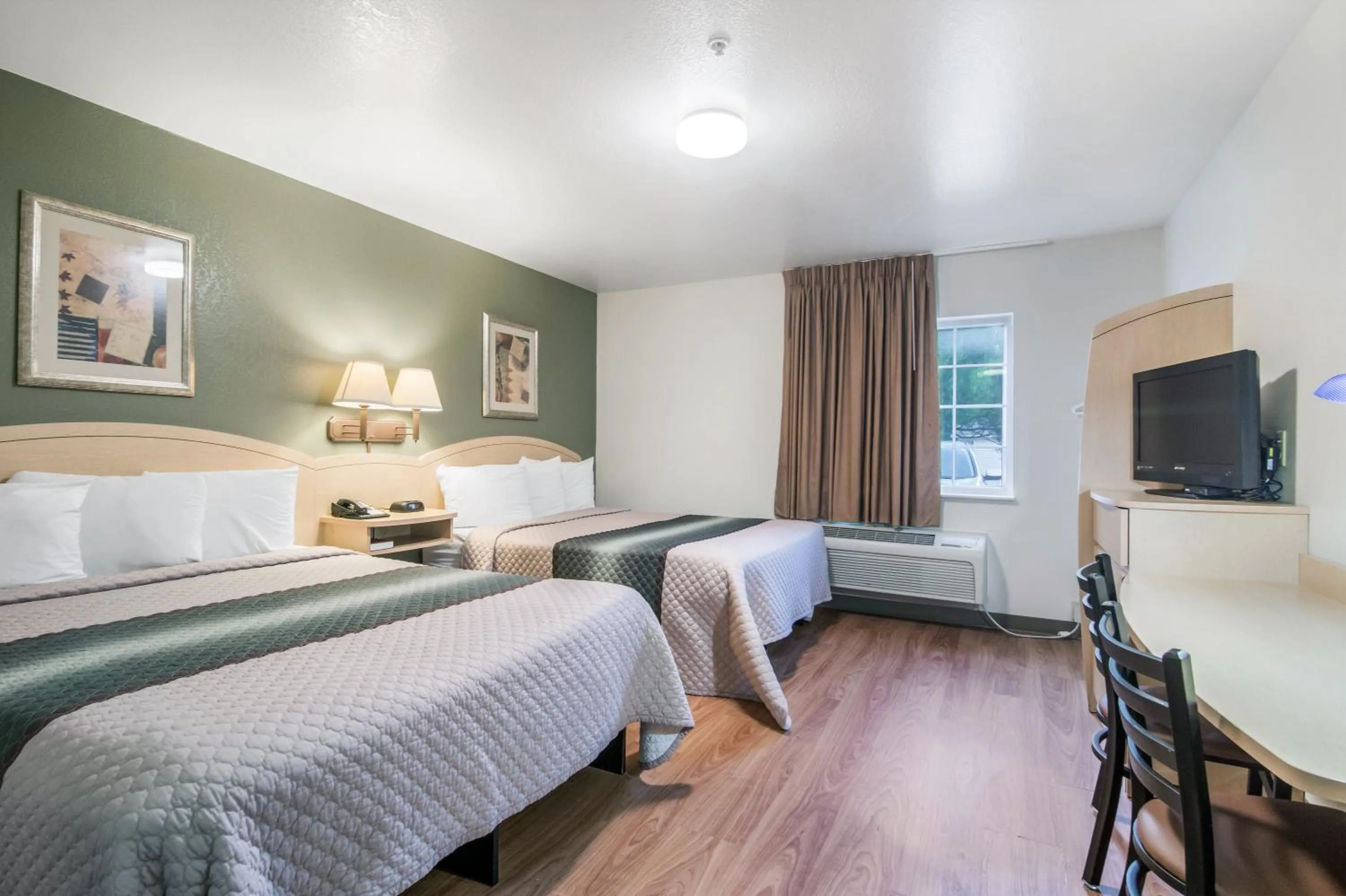 Photo of the whole room, Bed in HomeTowne Studios & Suites by Red Roof Bentonville