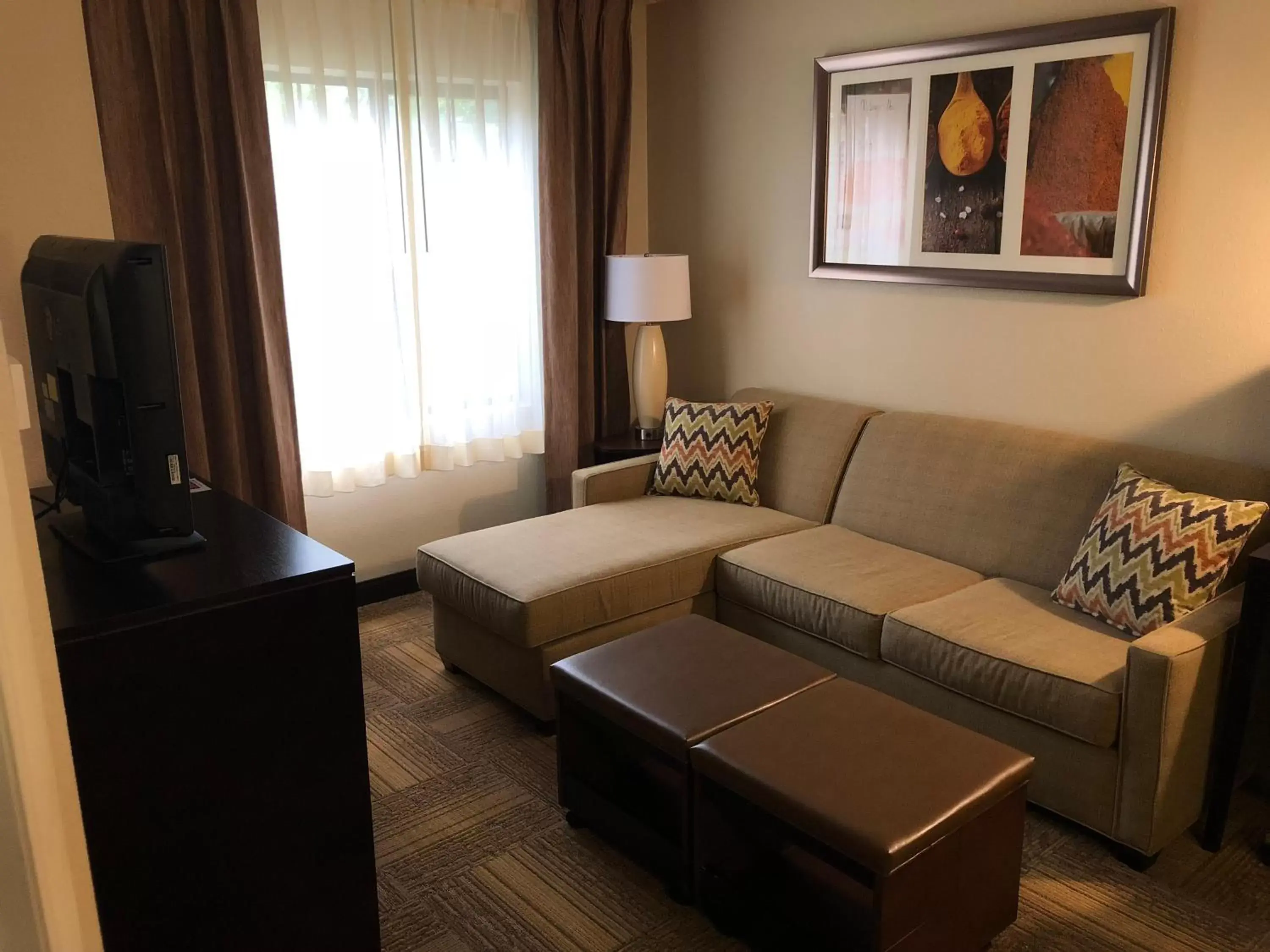 Communal lounge/ TV room, Seating Area in Staybridge Suites Grand Rapids-Kentwood, an IHG Hotel