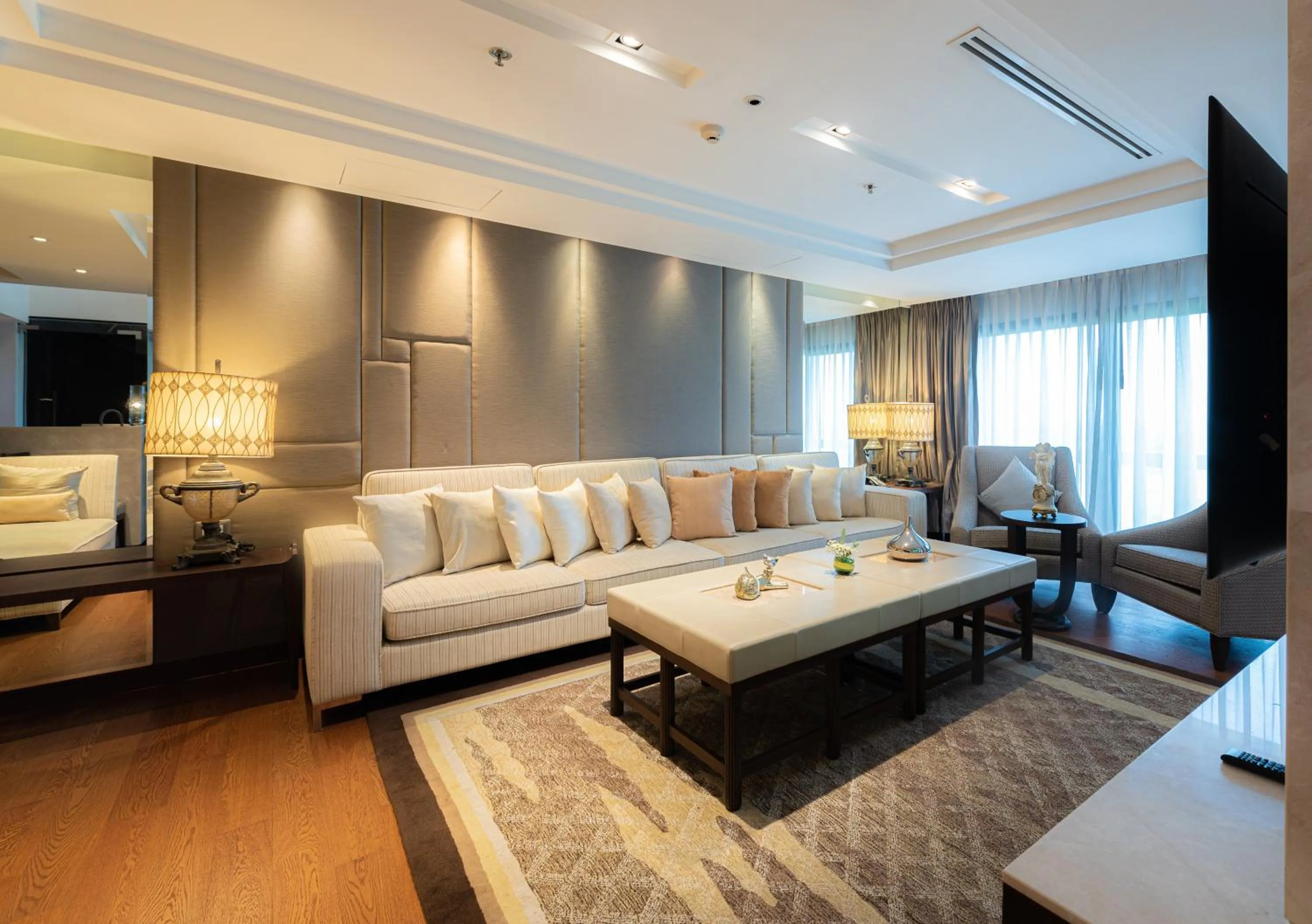 Living room in Summit Windmill Golf Suite Hotel at Suvarnabhumi