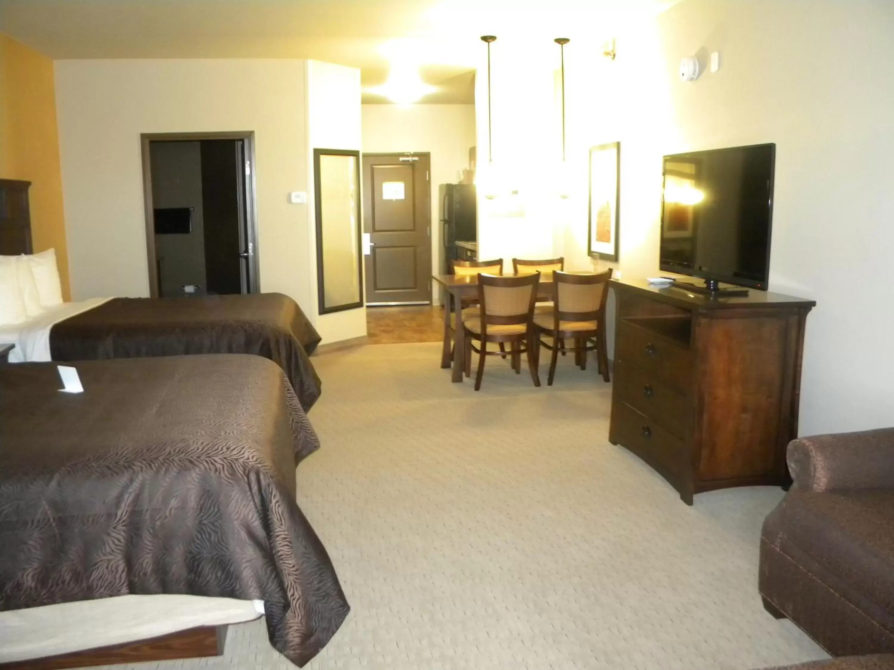 Bed, Seating Area in Teddy's Residential Suites Watford City